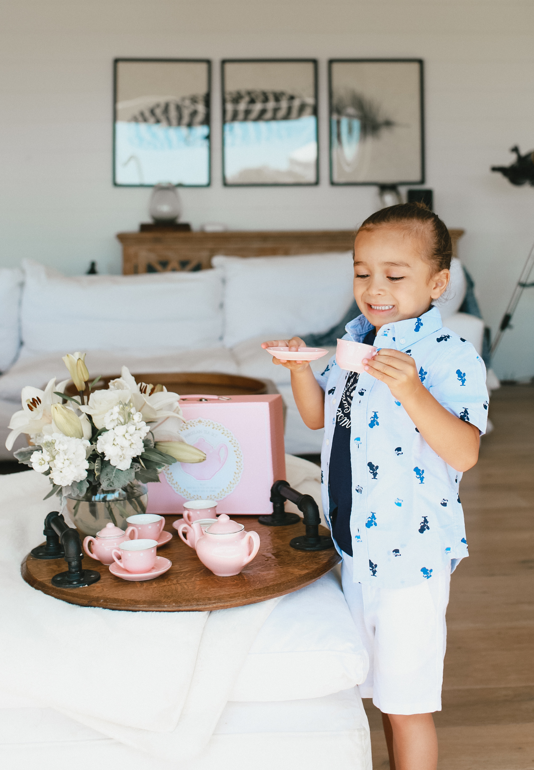 child holding teacup