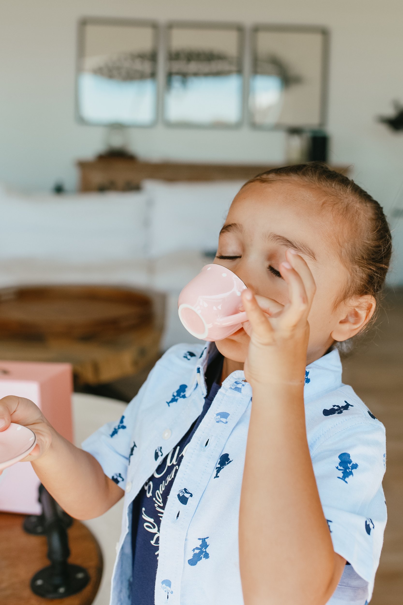 child drinking tea