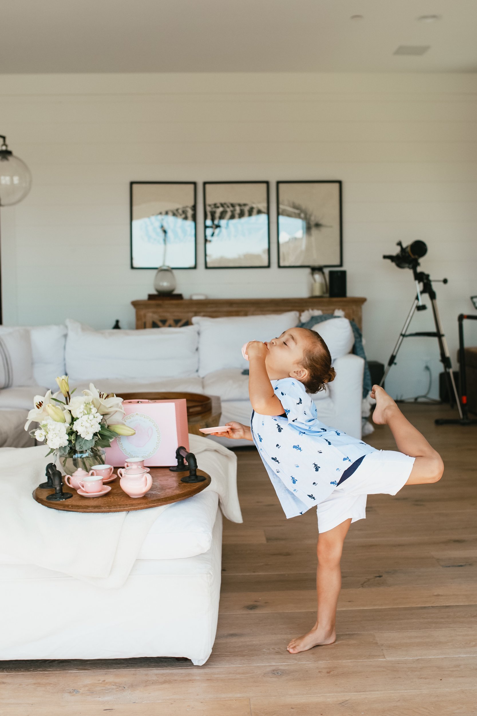 boy dancing with tea set