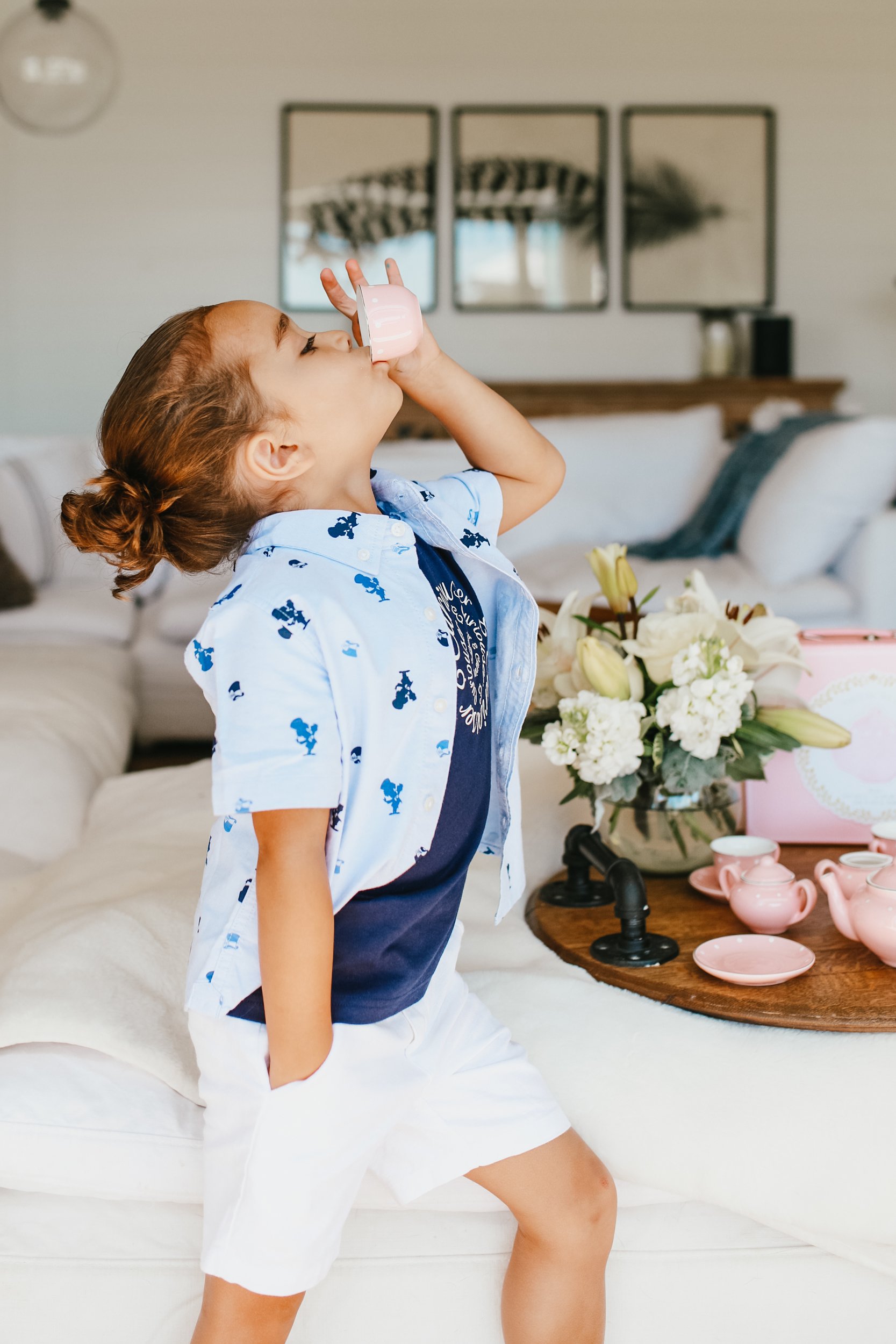 boy drinking from a teacup 