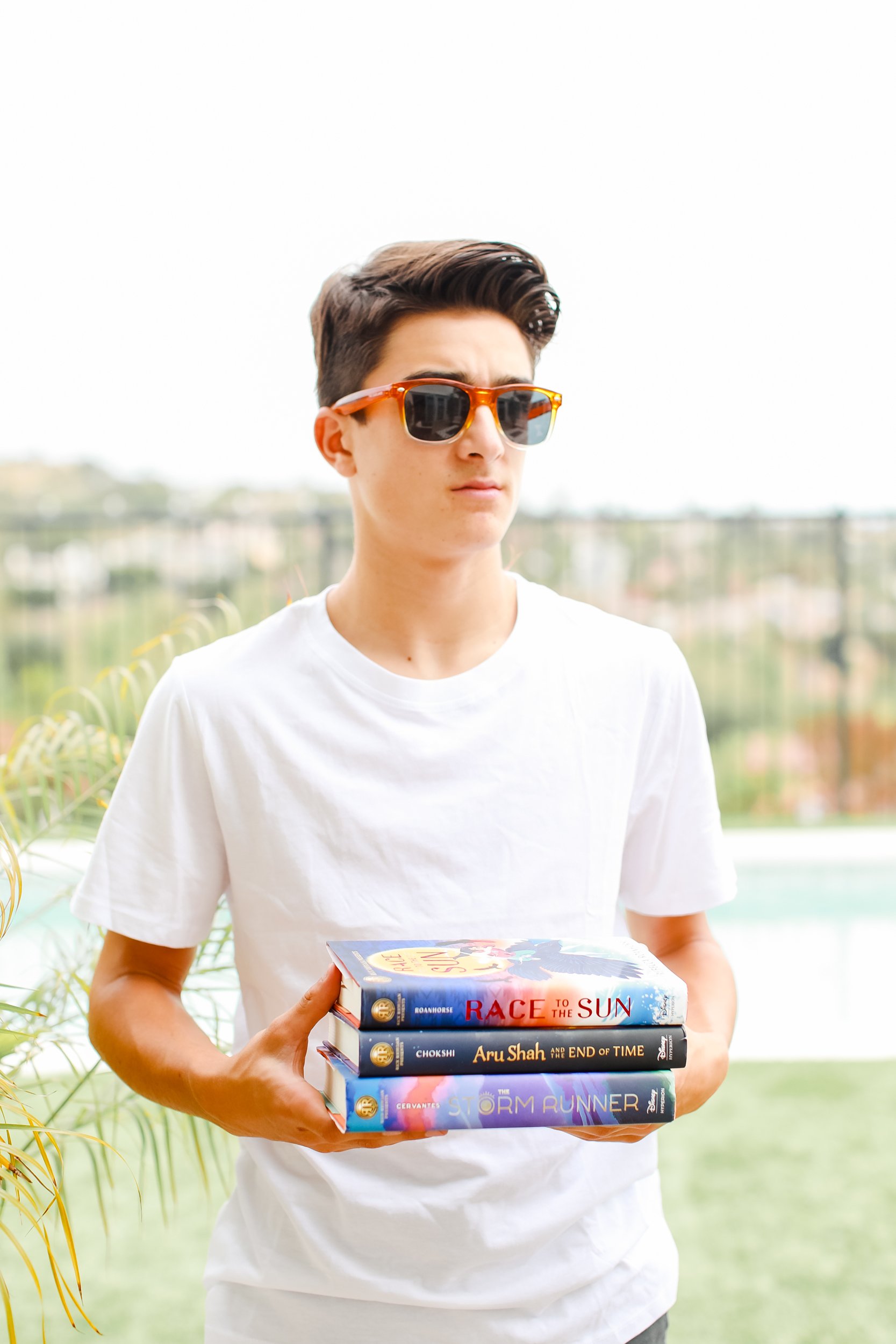 boy holding books