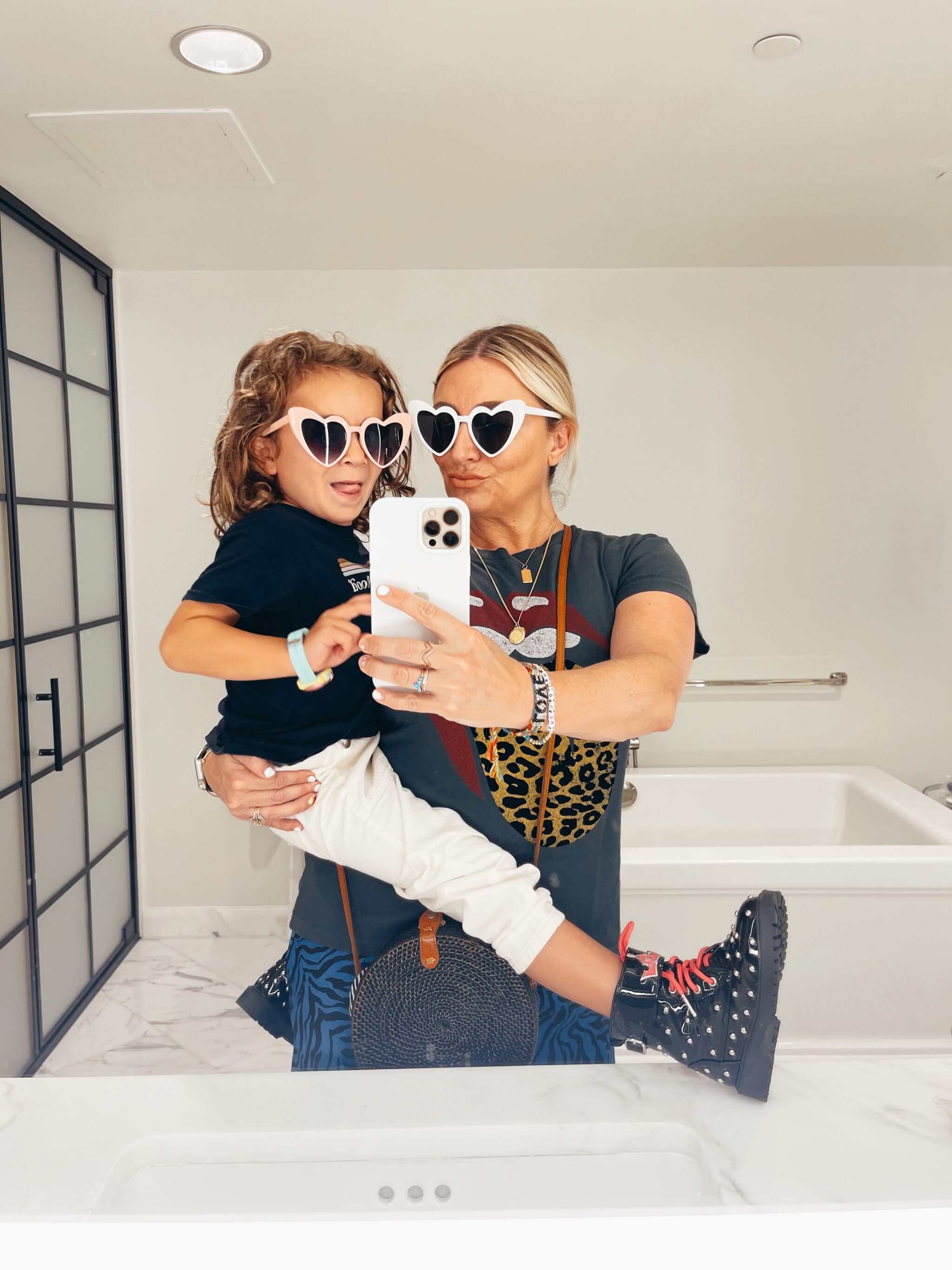 mom and toddler wearing matching heart sunglasses