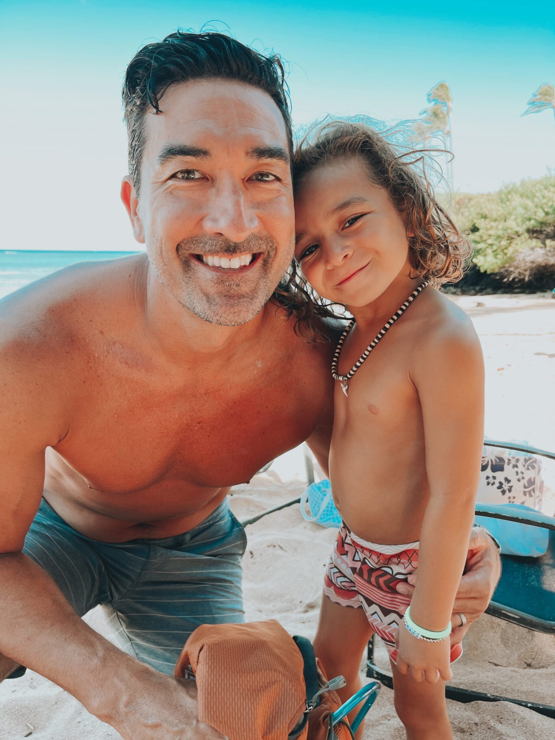 dad and son on the beach