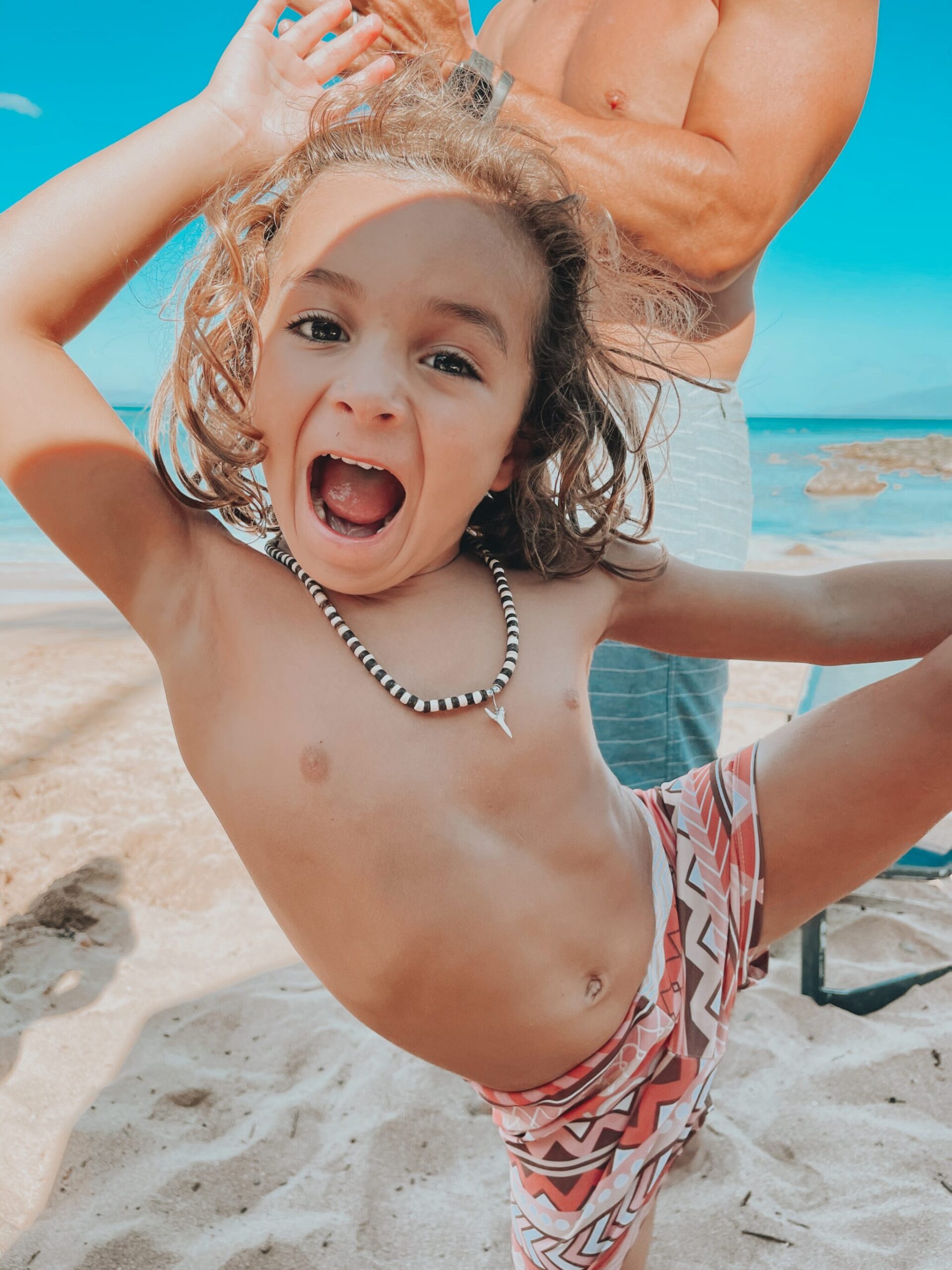 boy playing at the beach