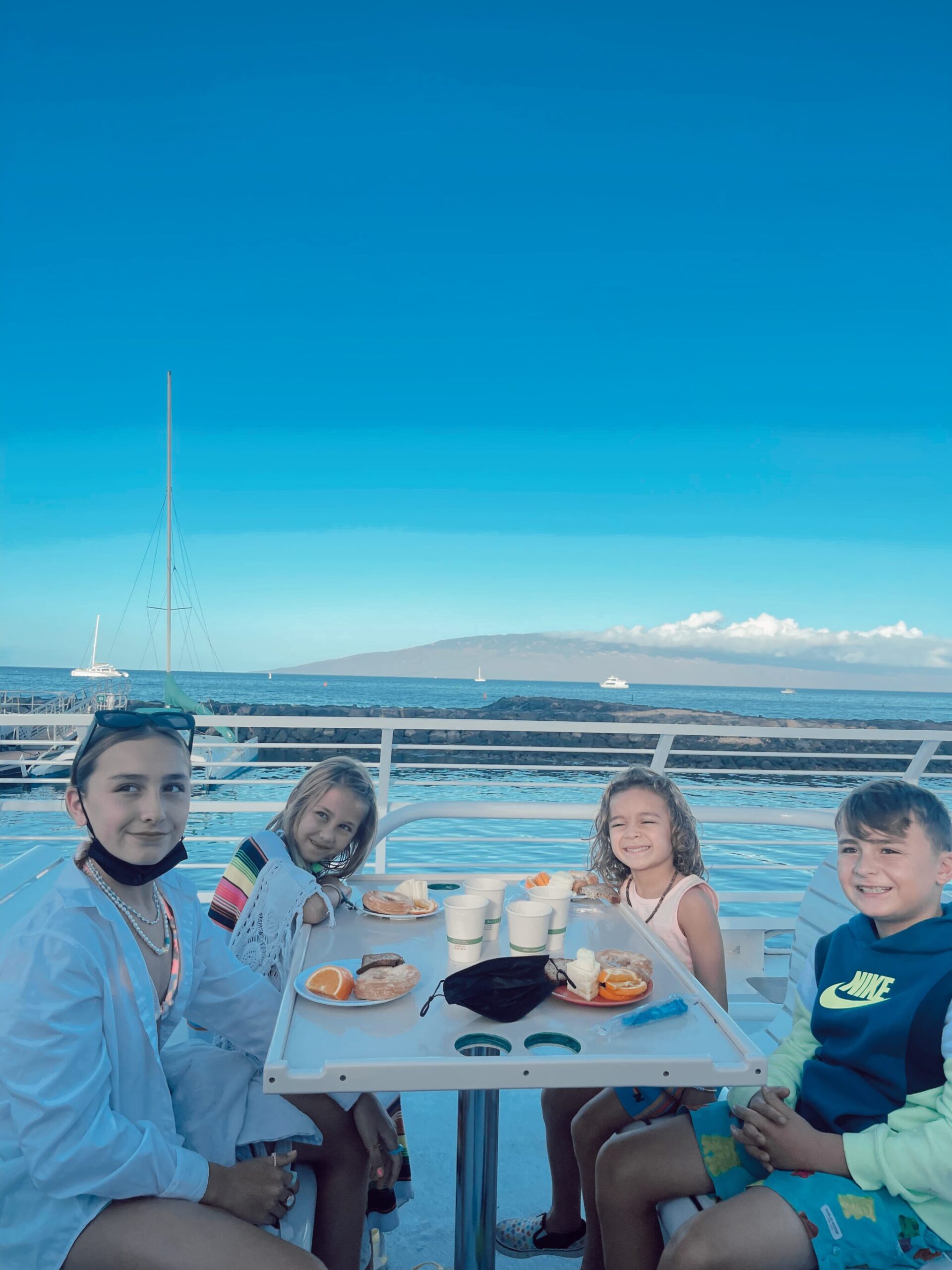 kids eating on a boat