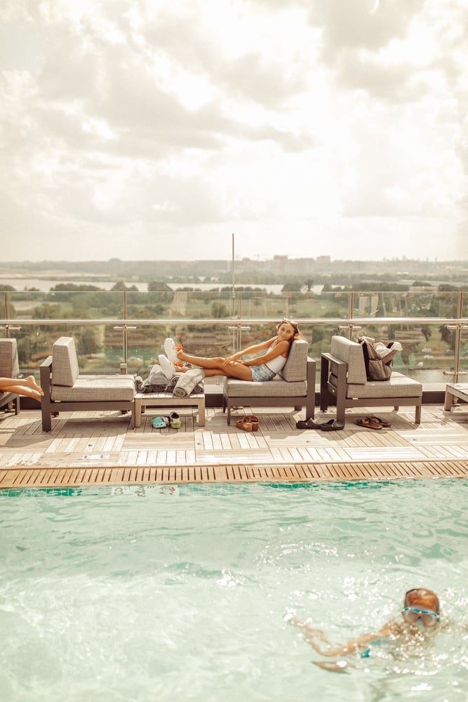 girl sitting by pool