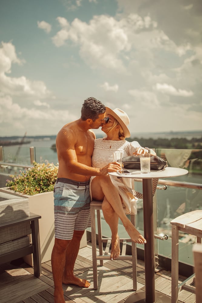 couple kissing on rooftop