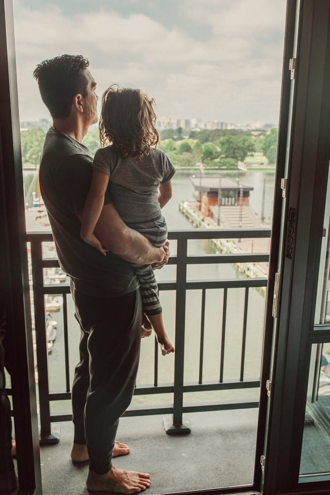 father and son on balcony