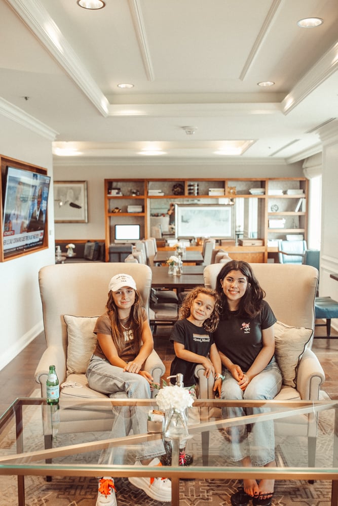 kids sitting in hotel room