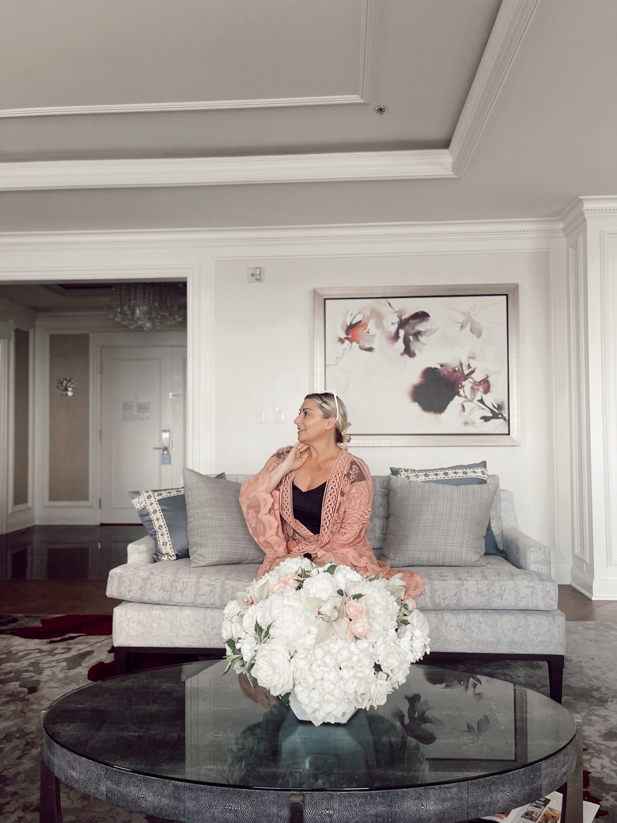 woman sitting on hotel couch