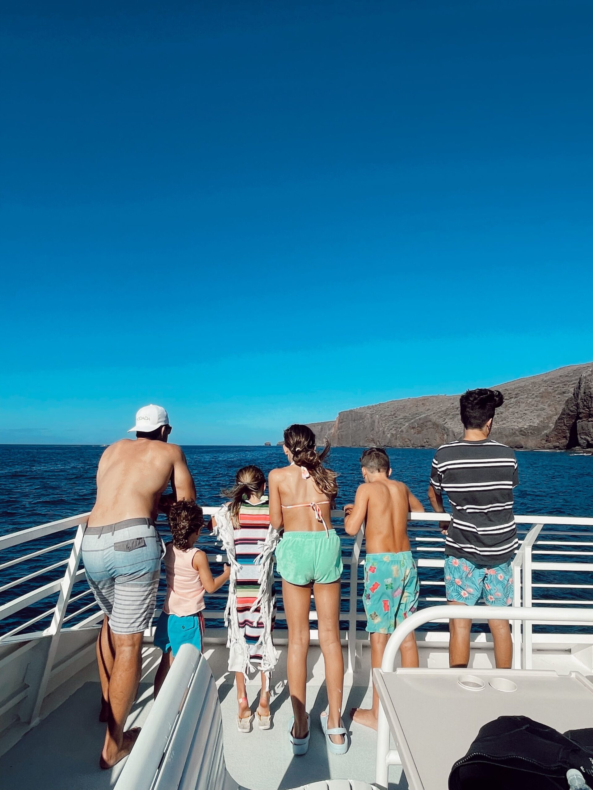 family on boat in maui