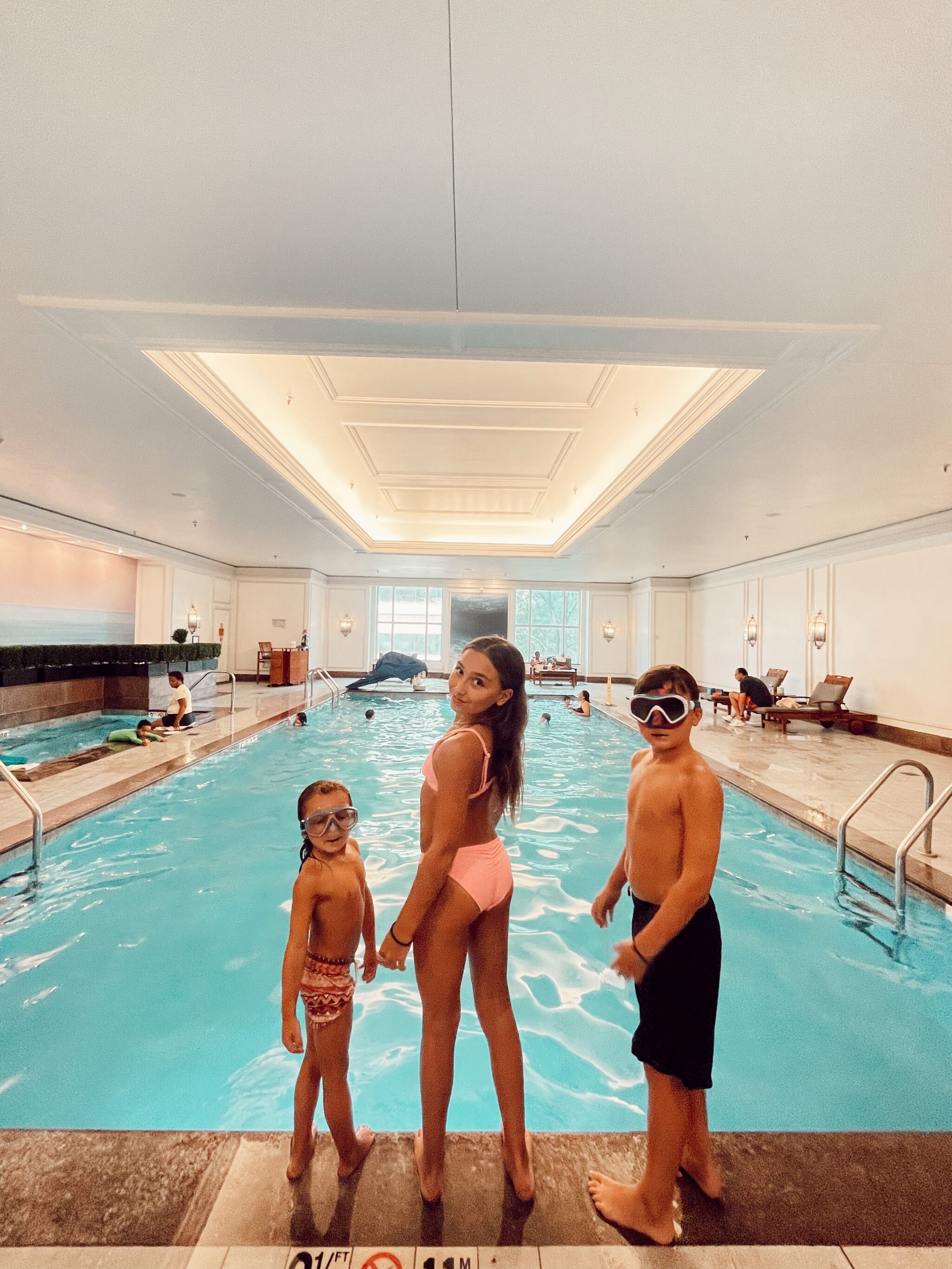 kids swimming in indoor pool