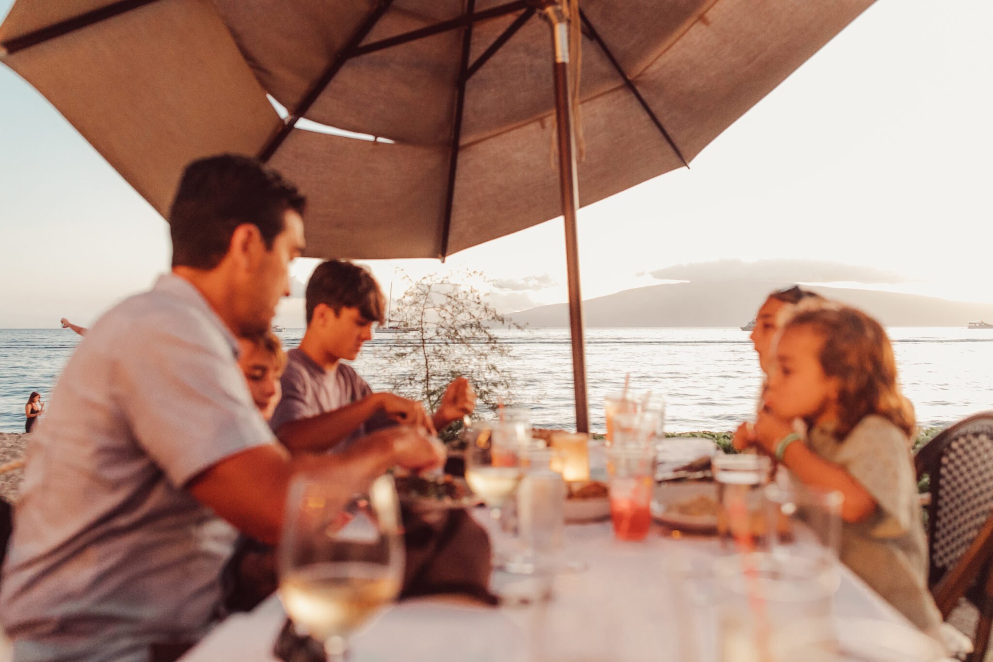 family dining at beach