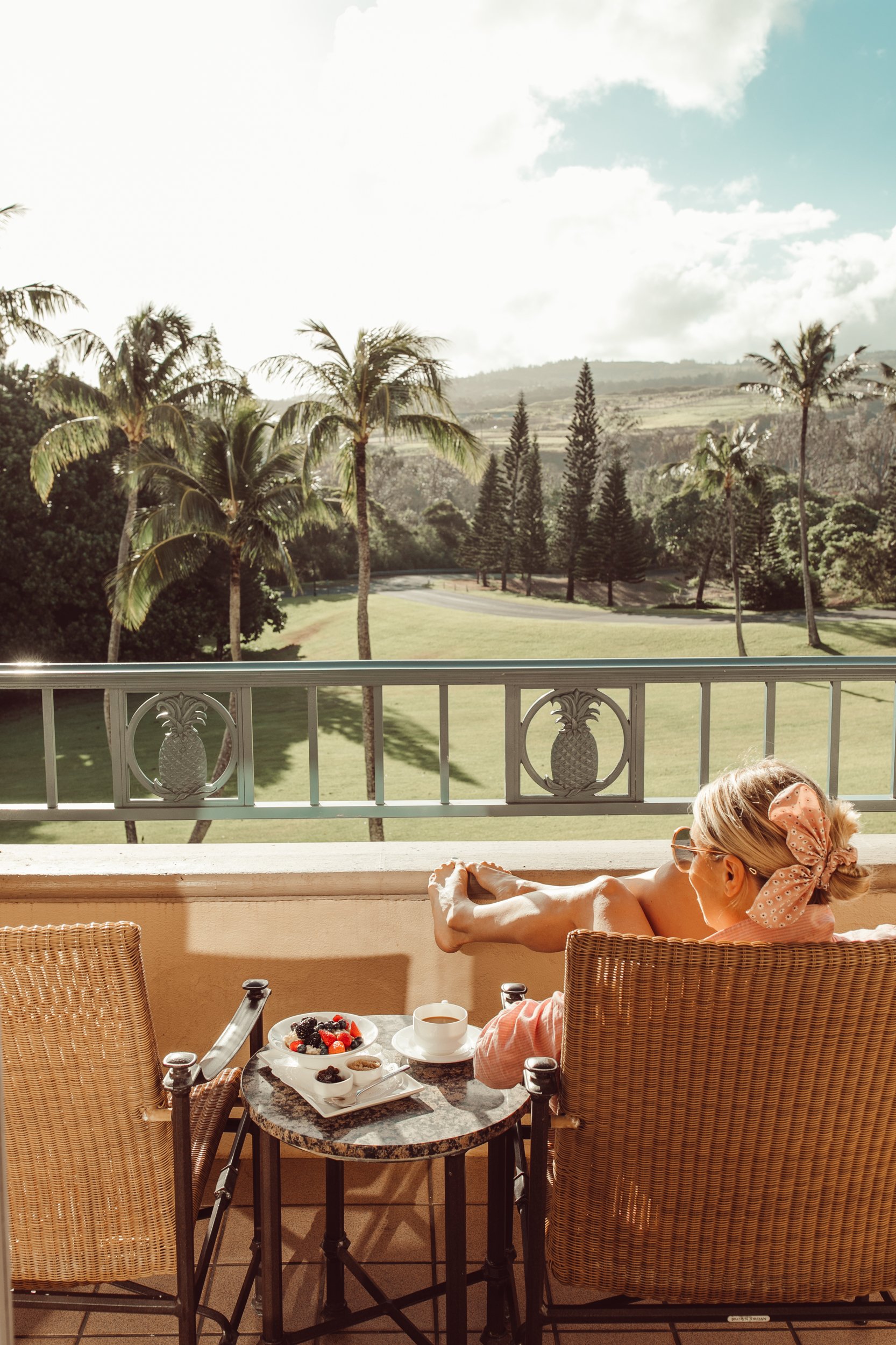 woman sunning on balcony in maui