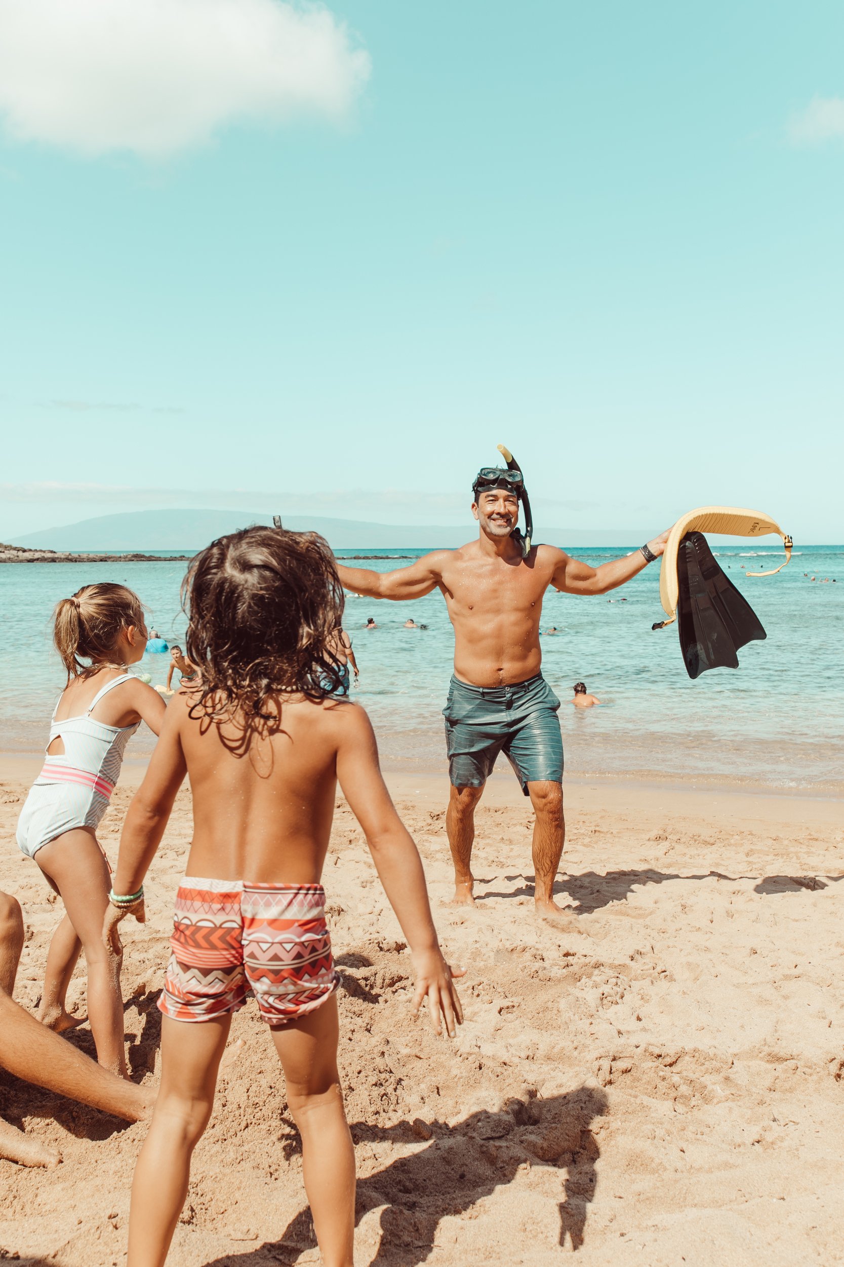 dads with kids at the beach