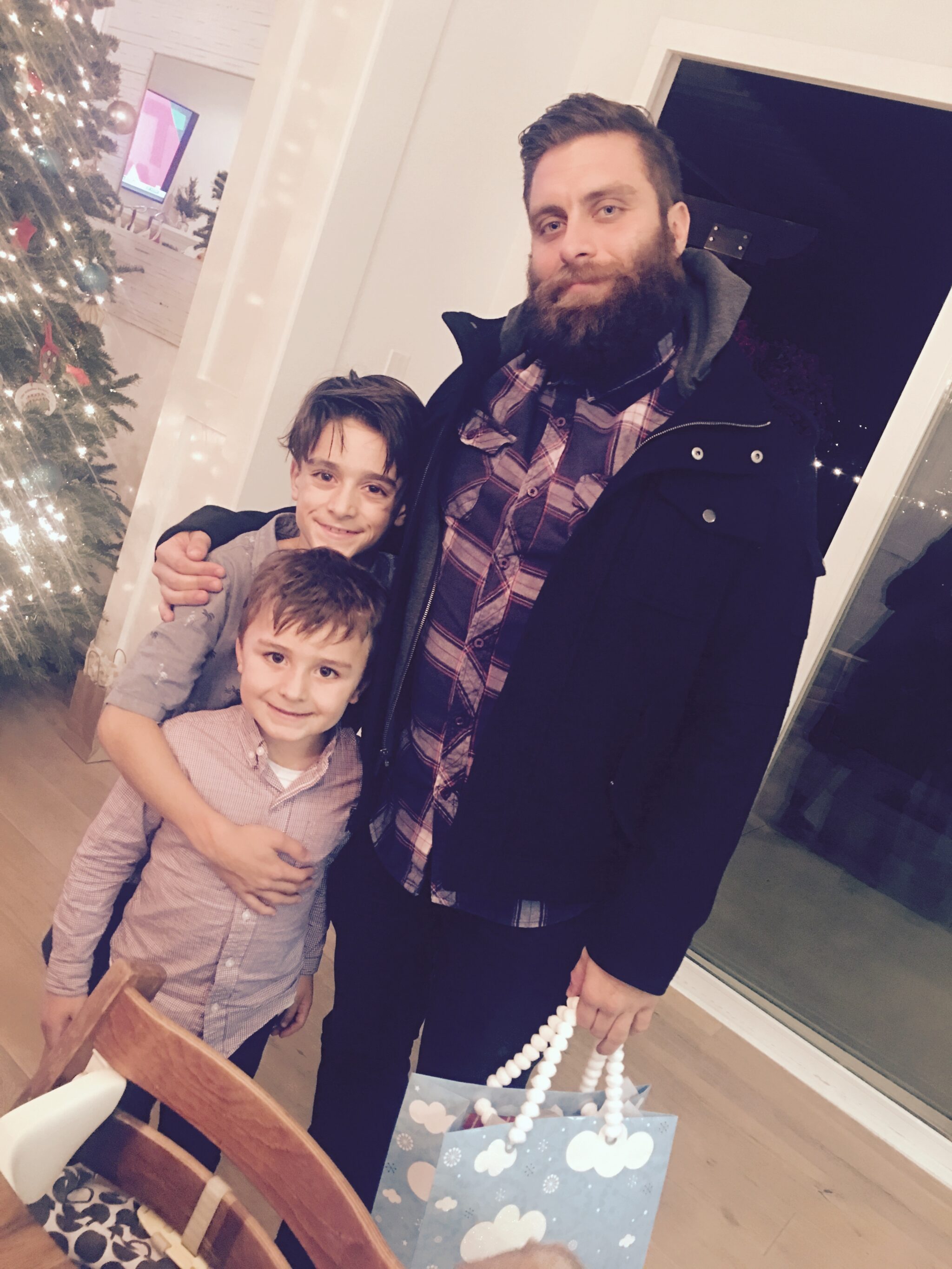 uncle with kids at christmas
