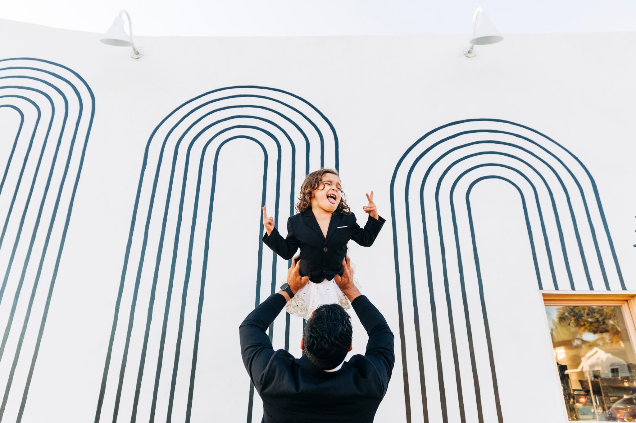 dad holding up son