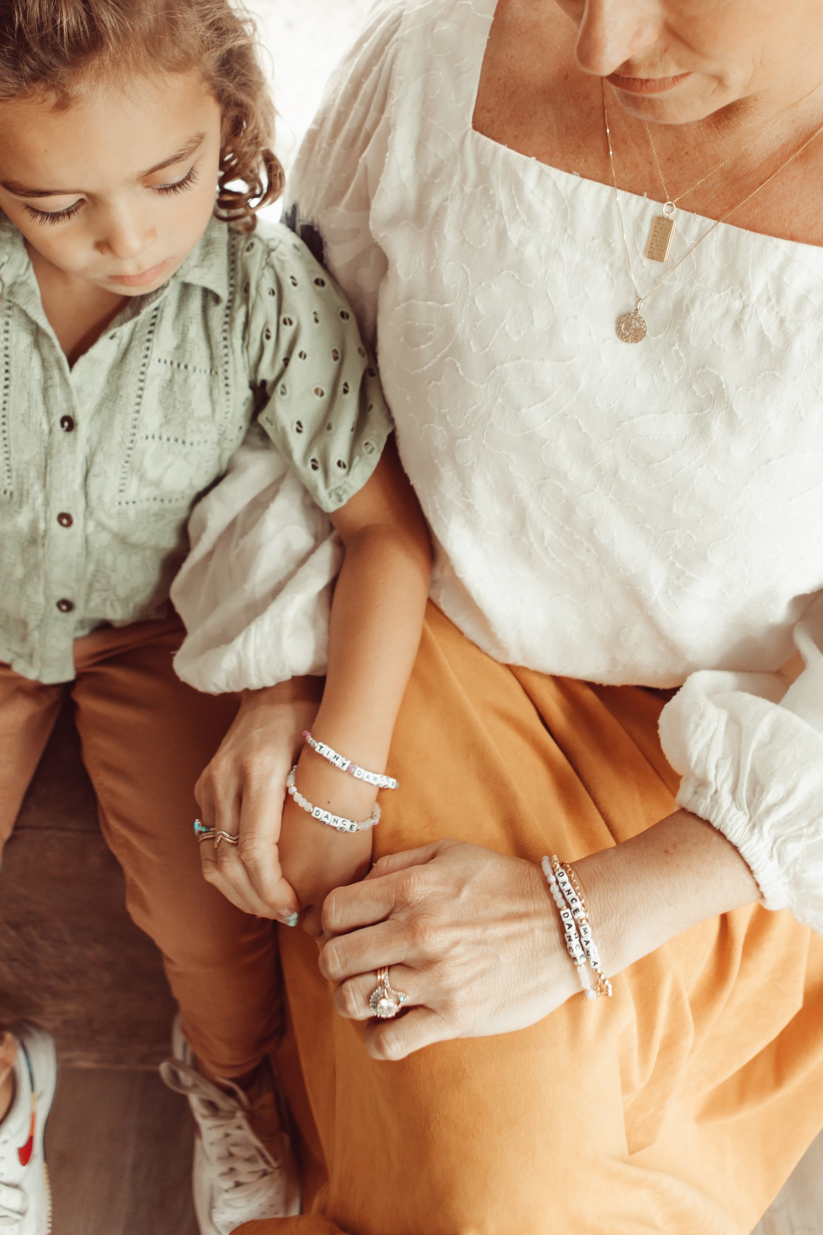 mom and toddler wearing matching bracelets