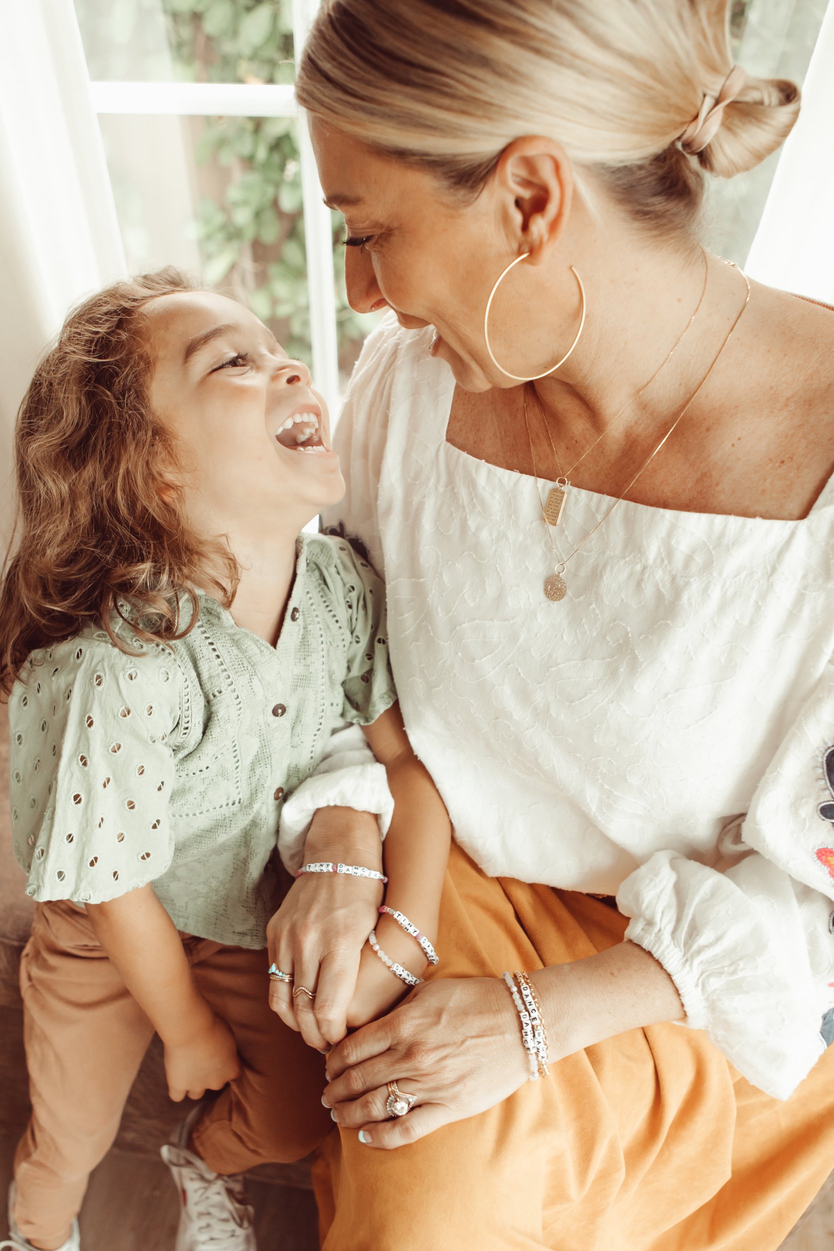 mom and toddler laughing