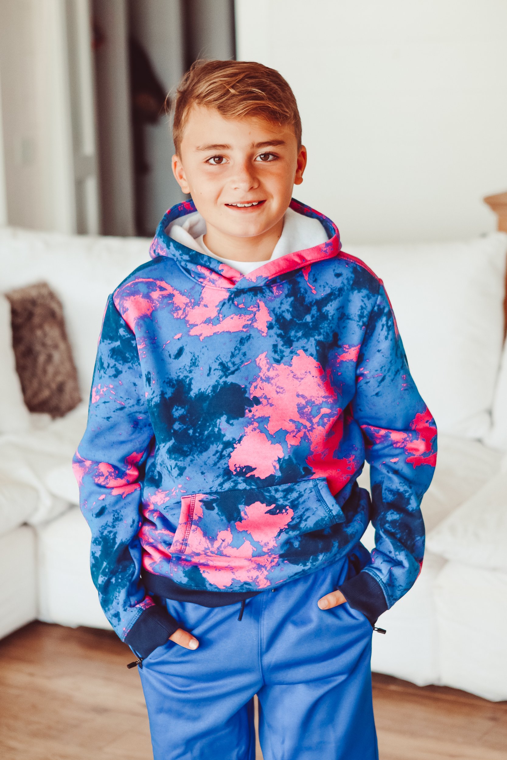 boy in bright sweatshirt