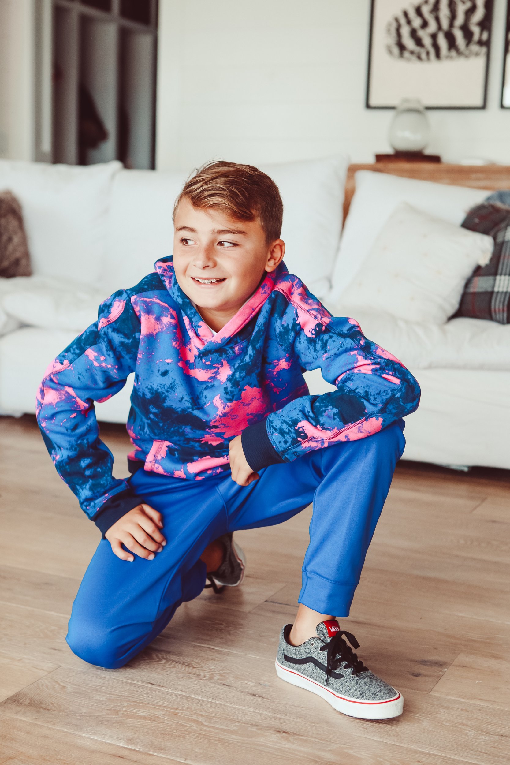 boy kneeling on floor