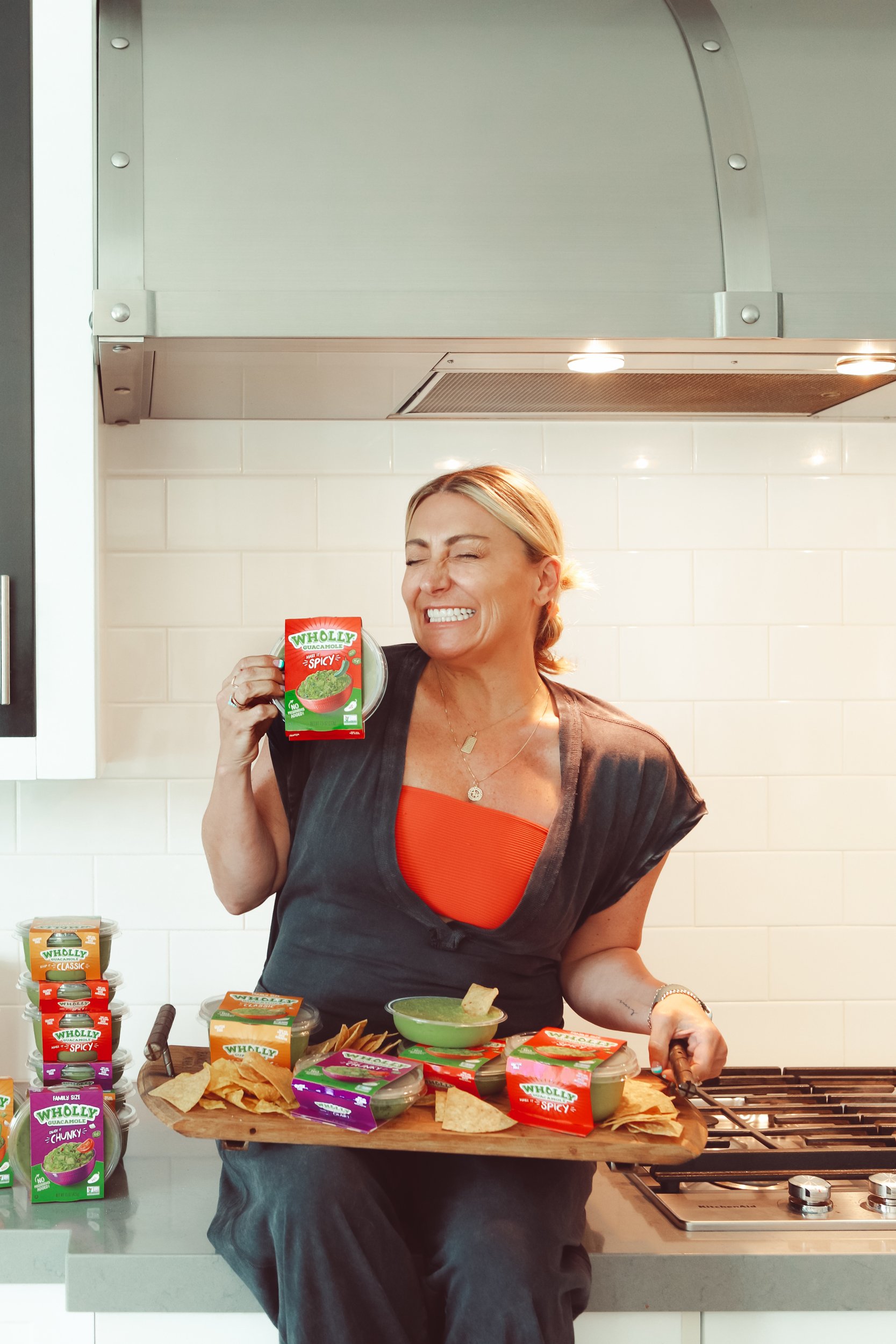 woman holding guacamole