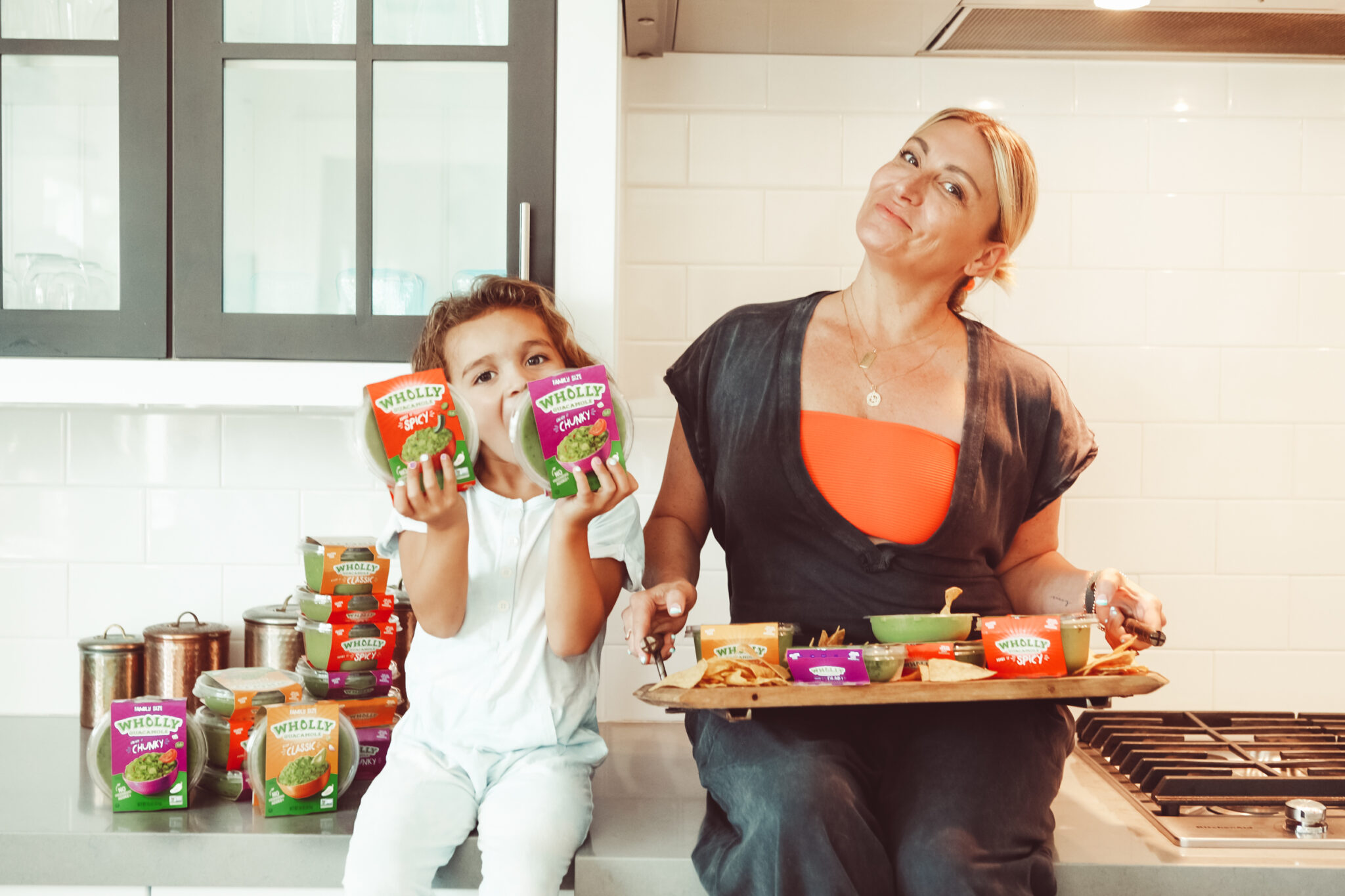 mom and toddler sitting in kitchen