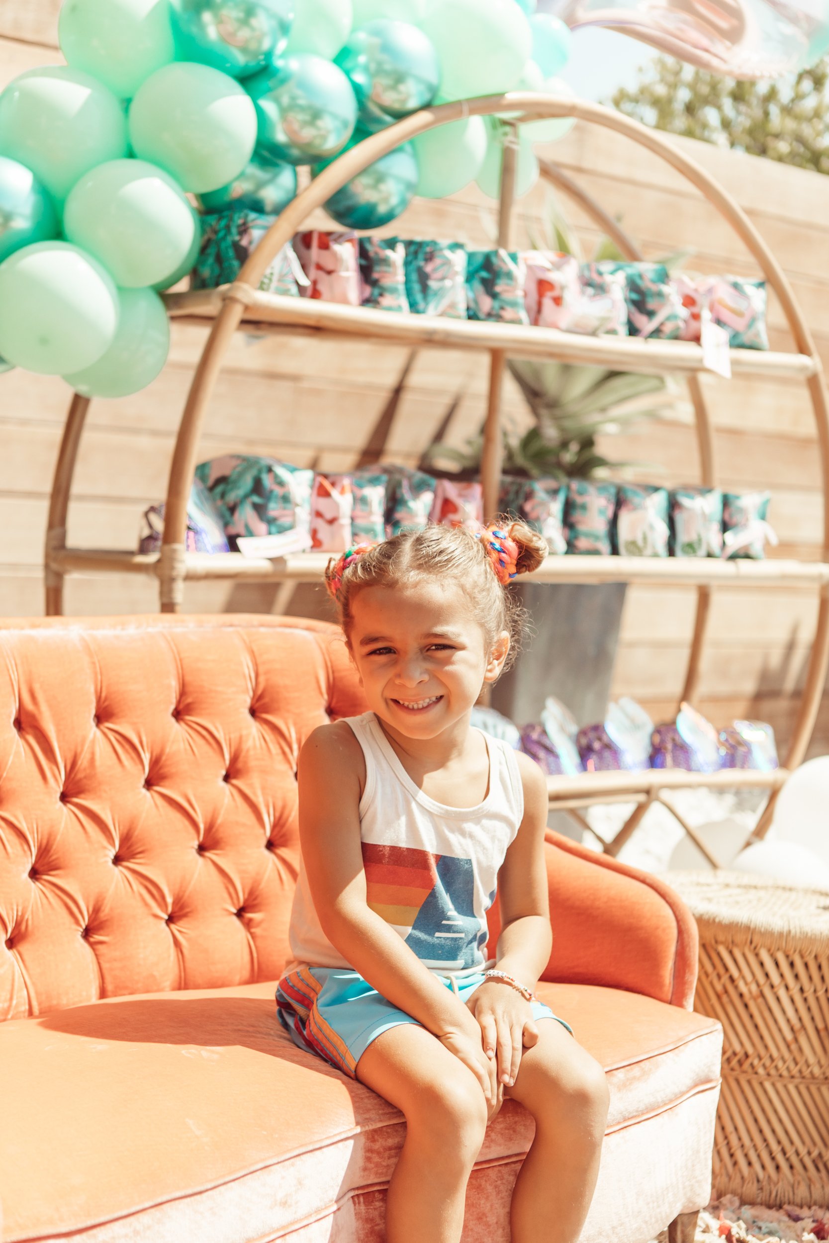 boy sitting on couch smiling