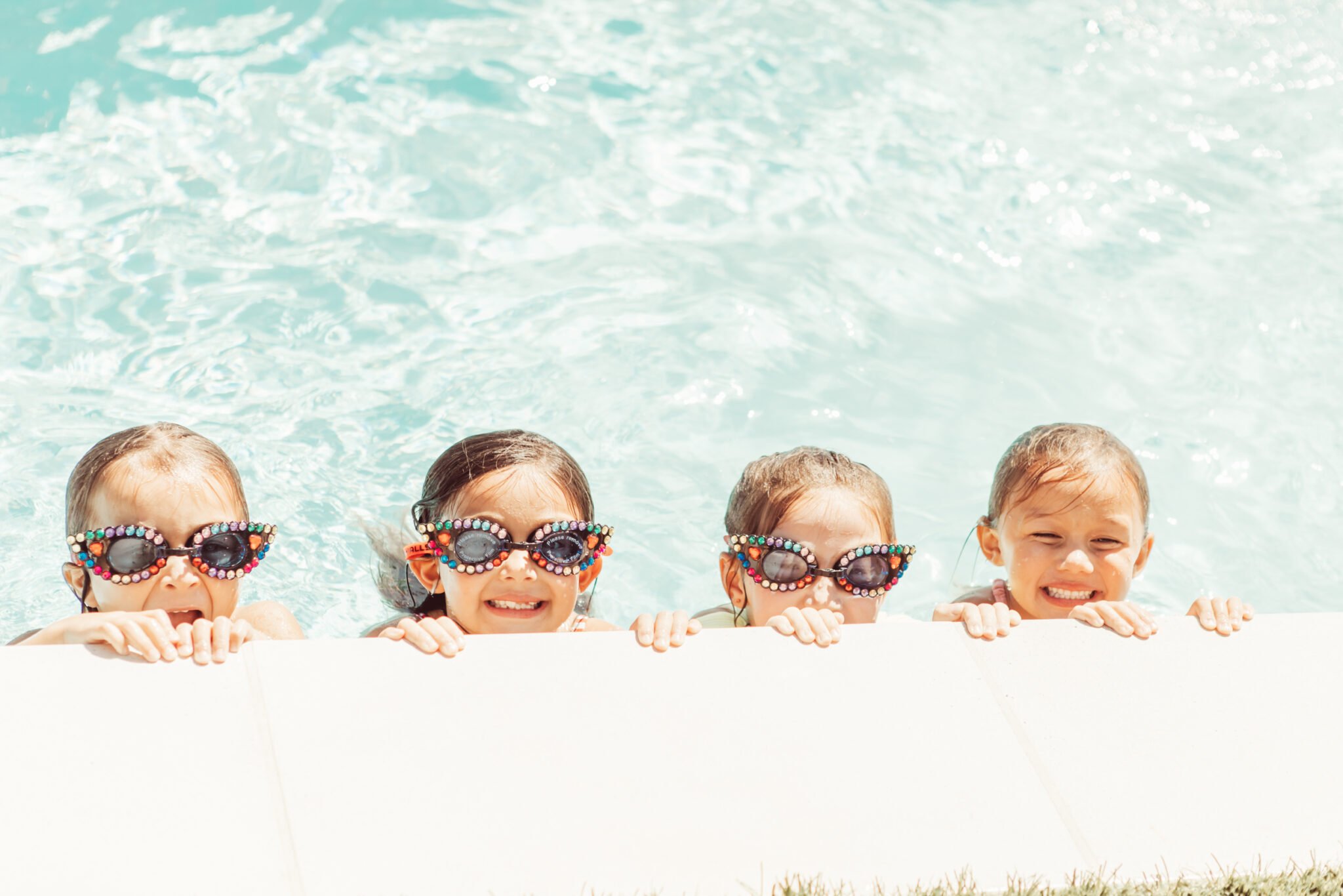 kids with goggles in the pool