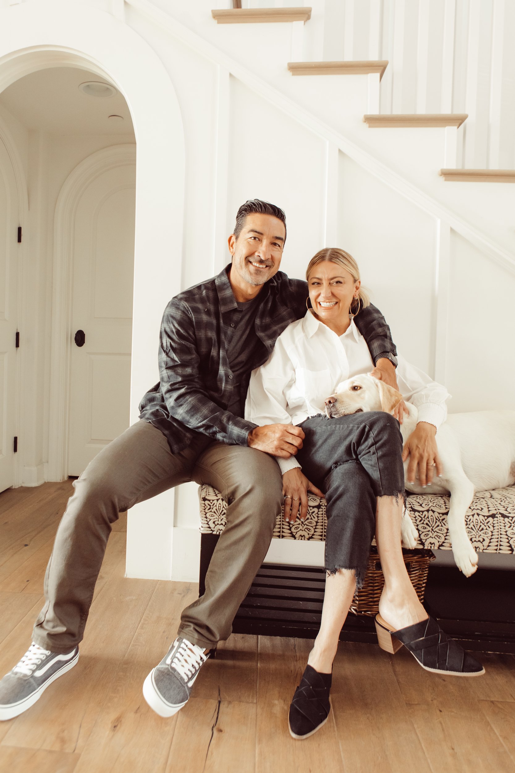 couple sitting with their dog