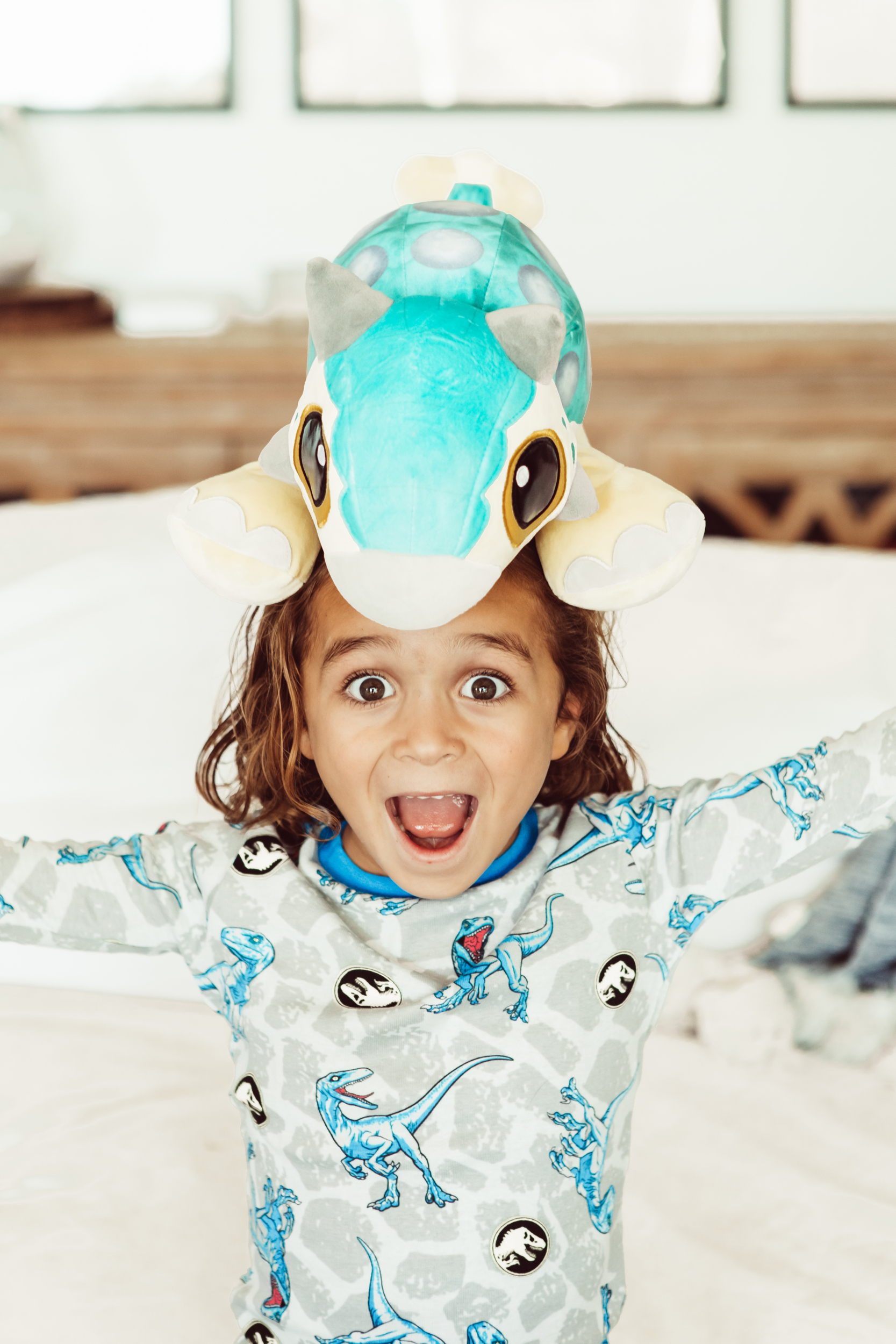 boy with stuffed dinosaur