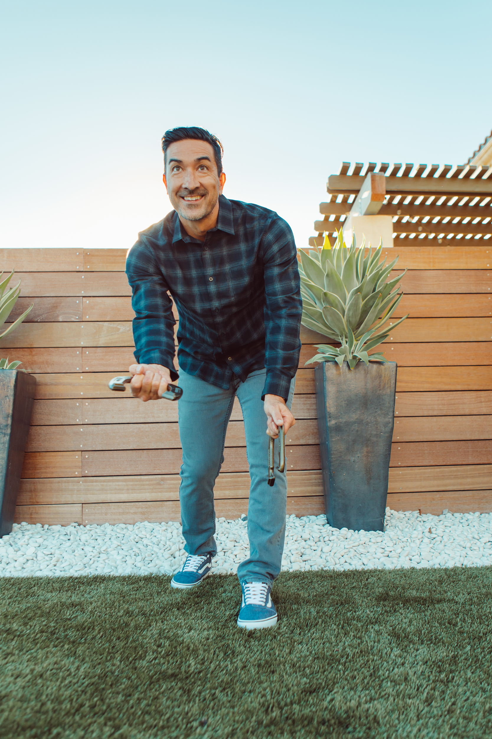 man playing horseshoes