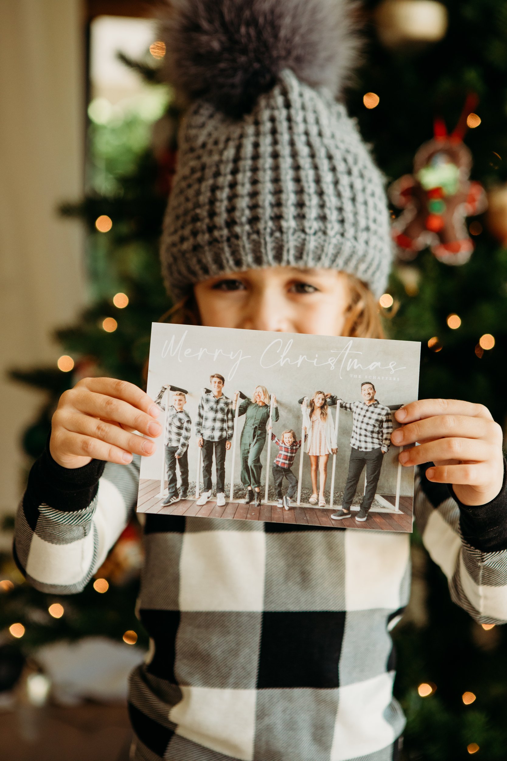 boy holding christmas card