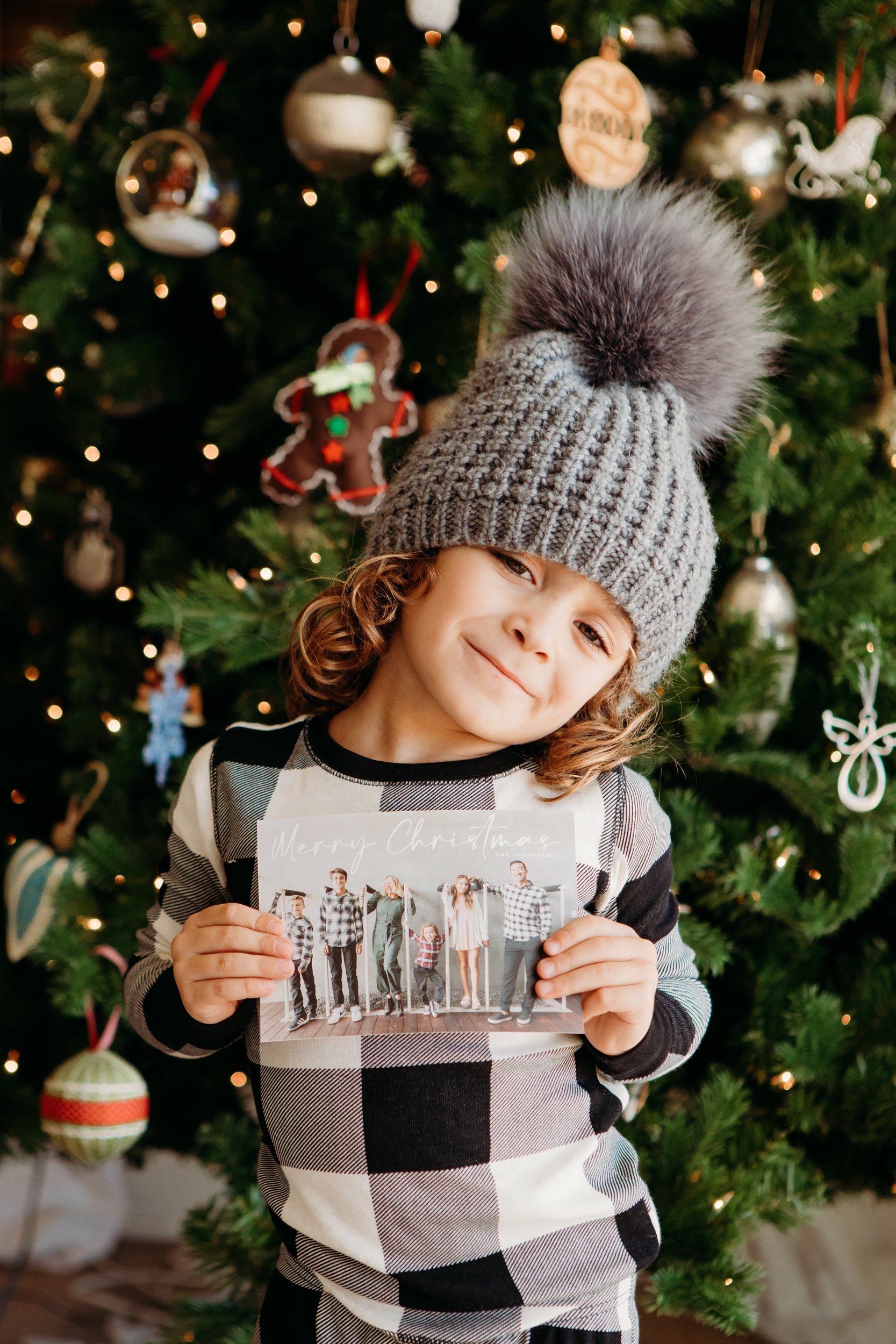 boy holding christmas card