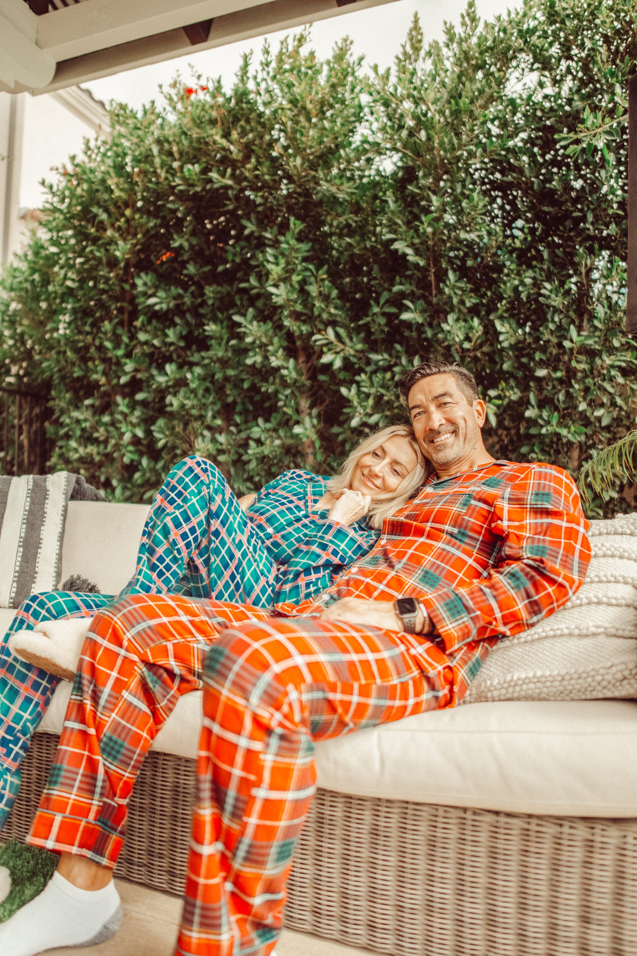 couple snuggling on couch in pajamas