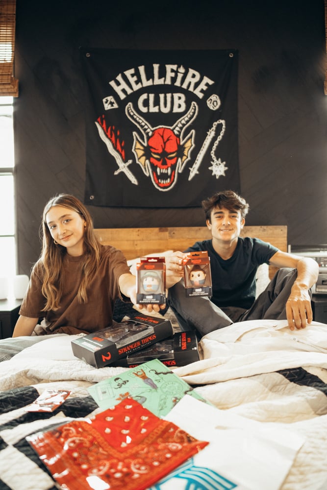 kids on bed with toys