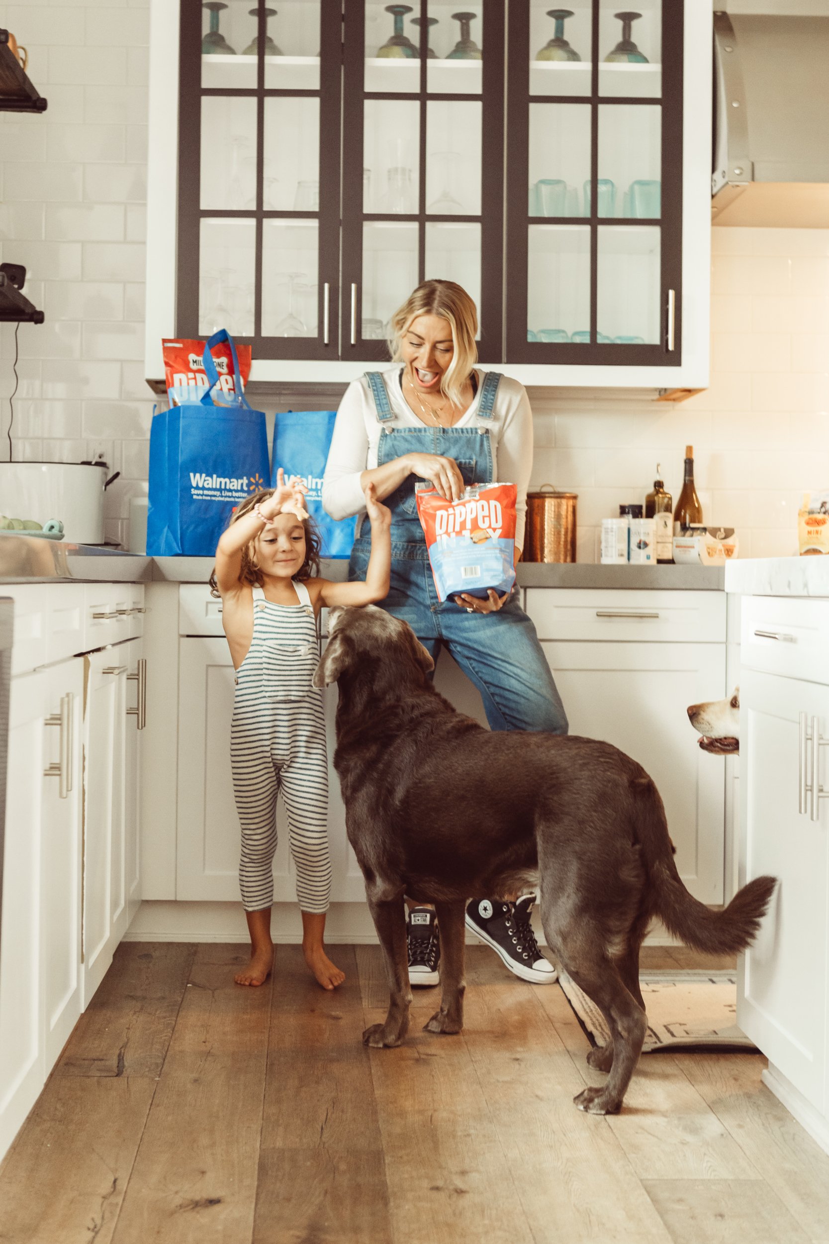 mom and son feeding the dog