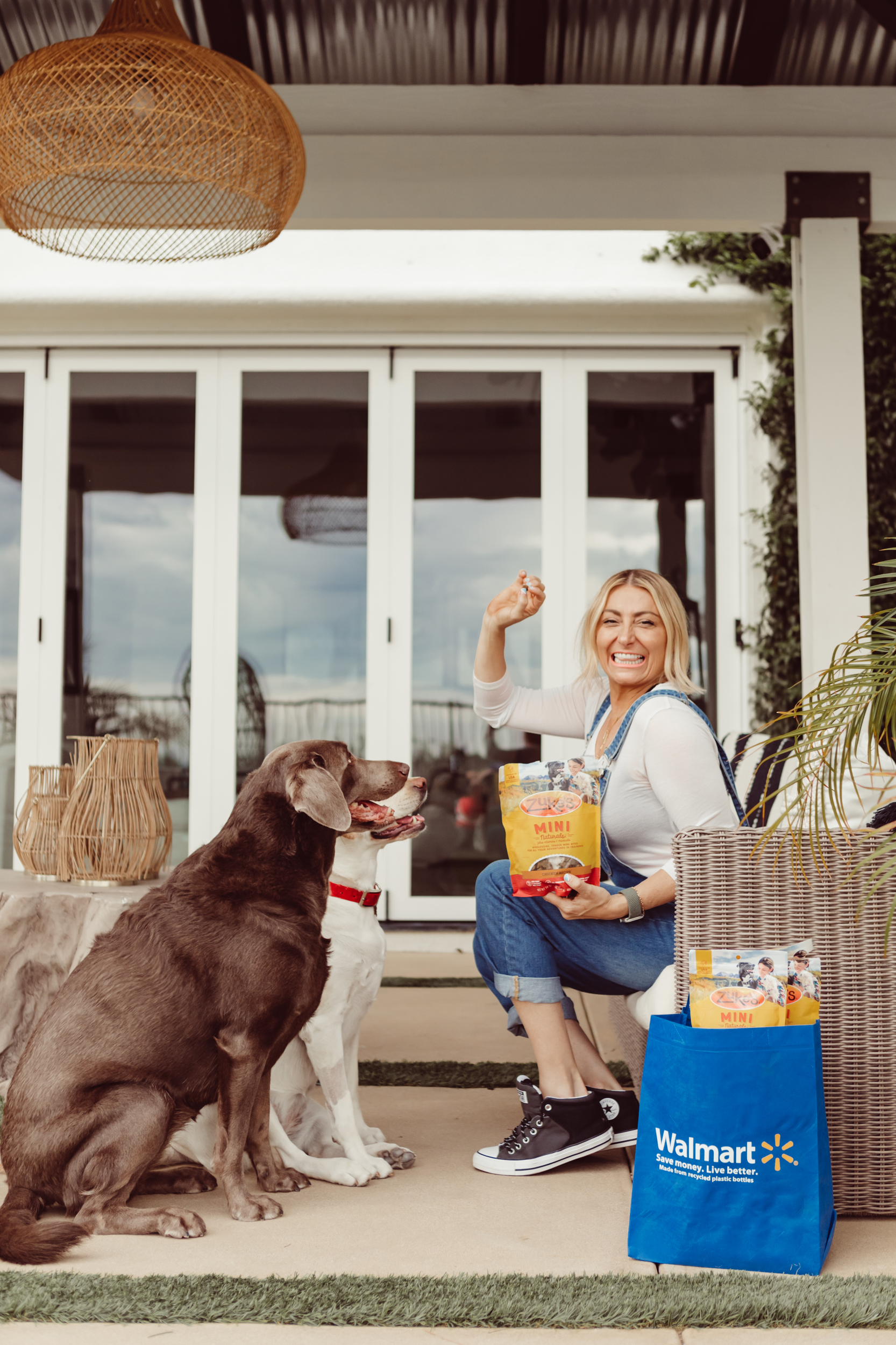 woman giving dogs a treat