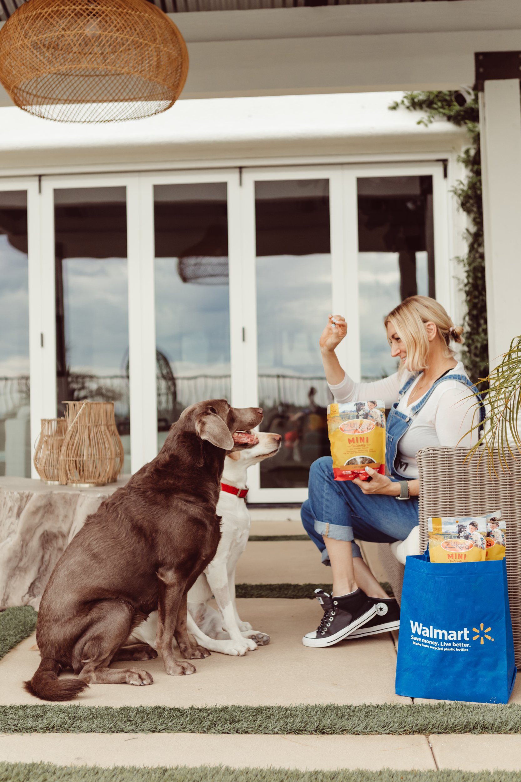 woman giving her pets walmart treats