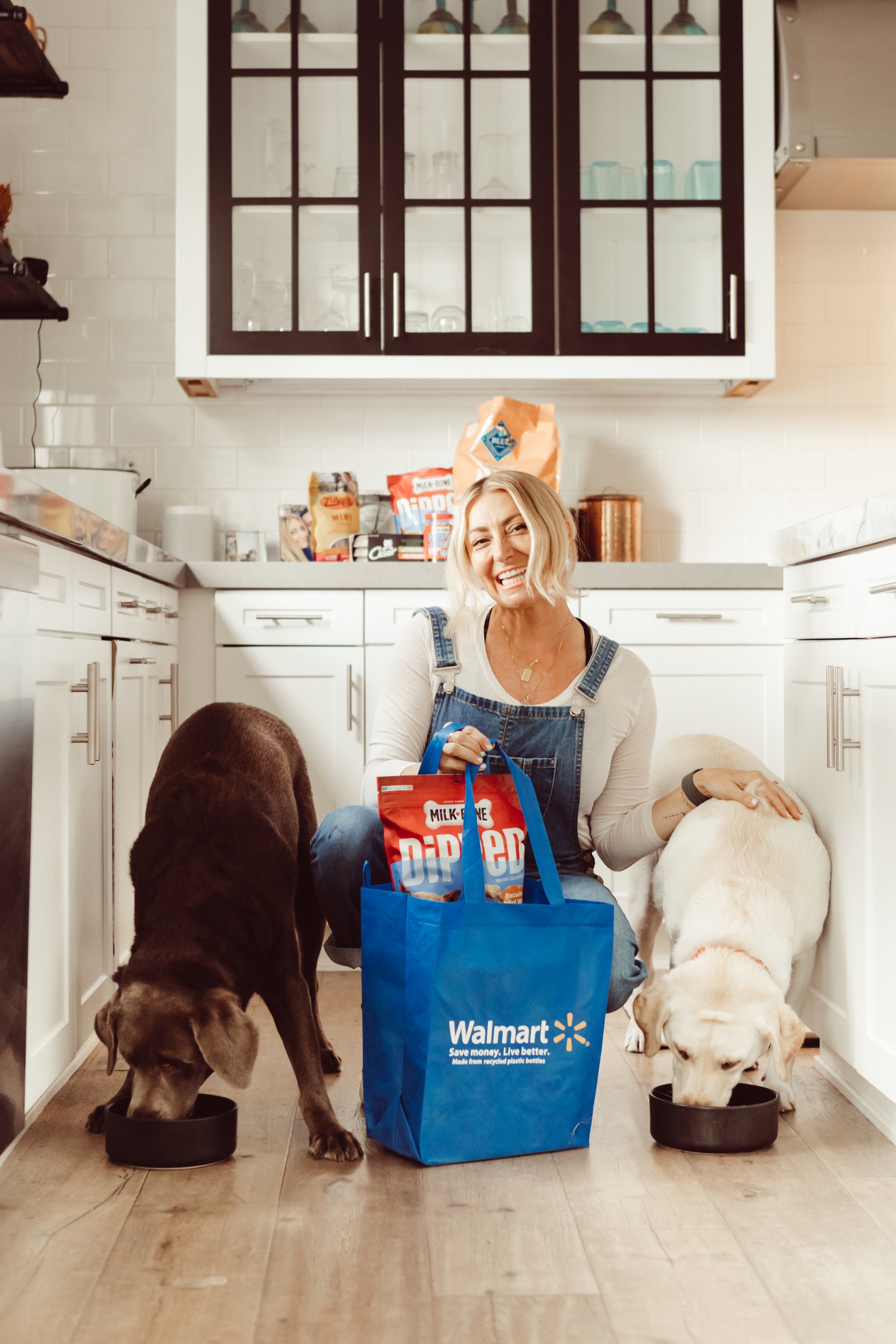 woman with her dogs in the kitchen