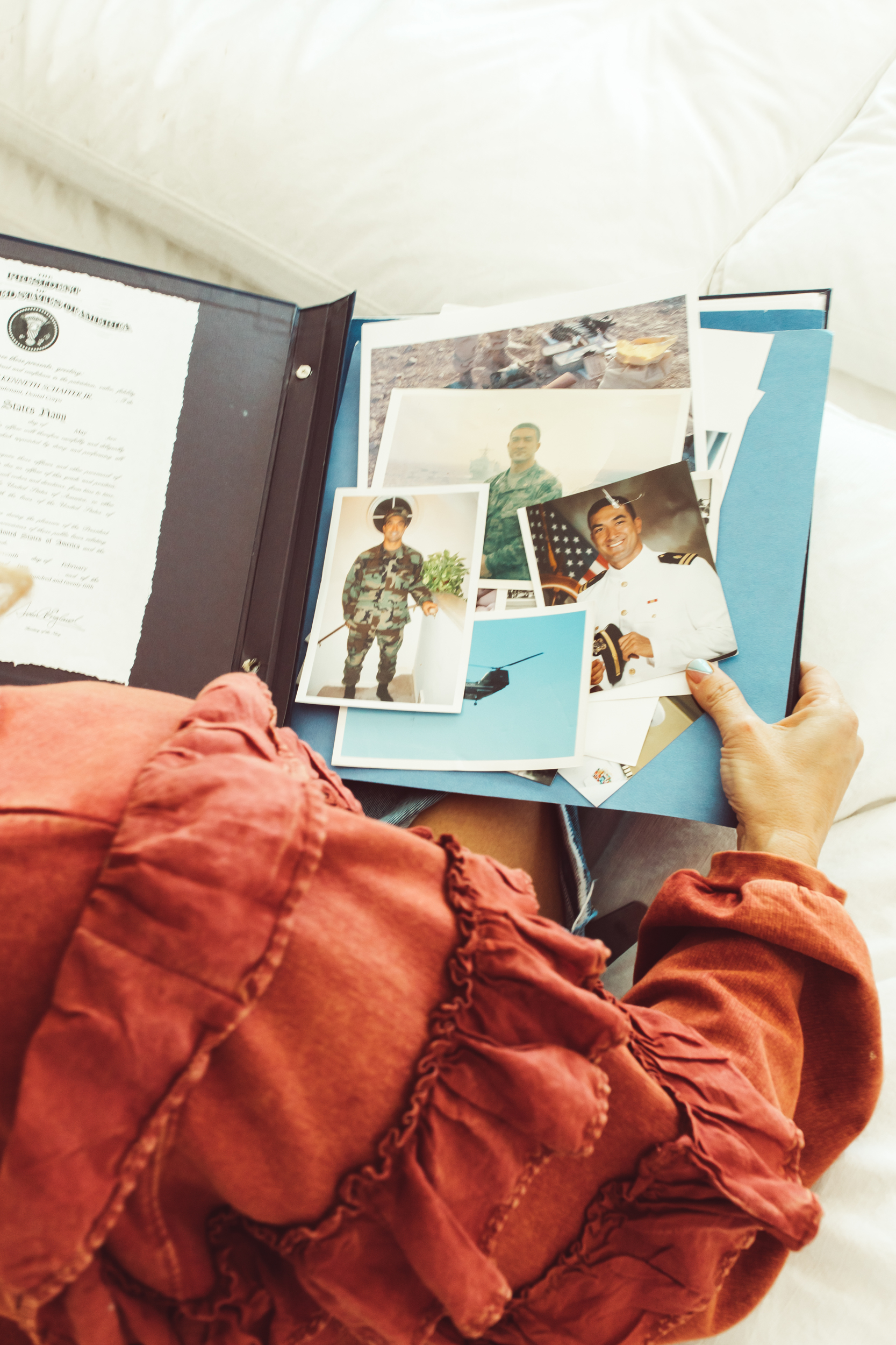 woman looking at scrapbook