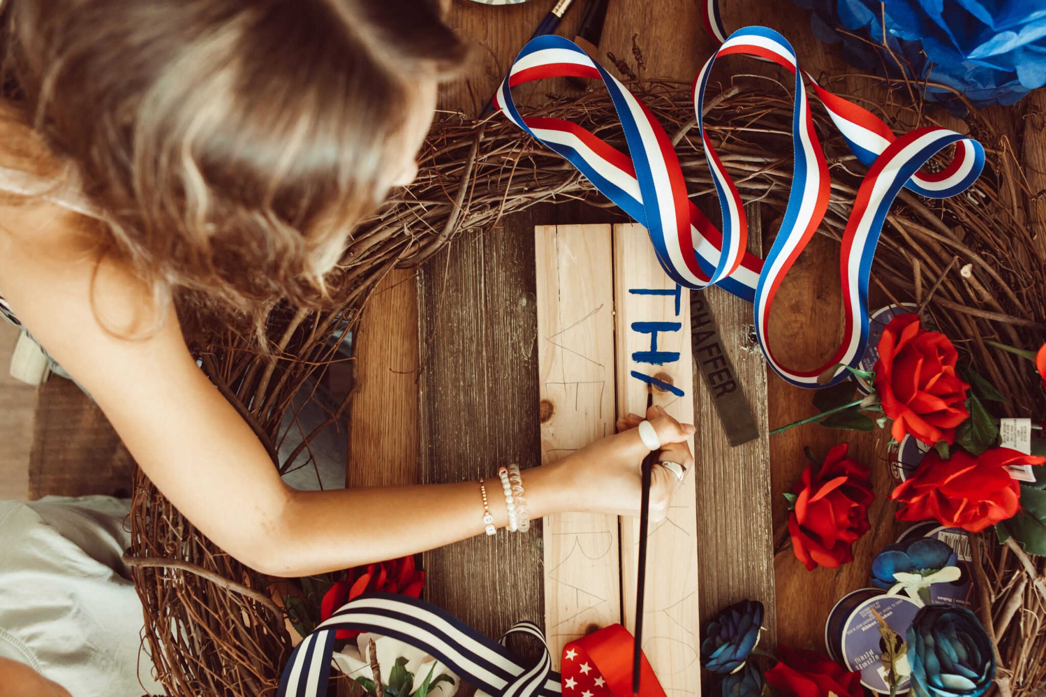 girl painting on wood