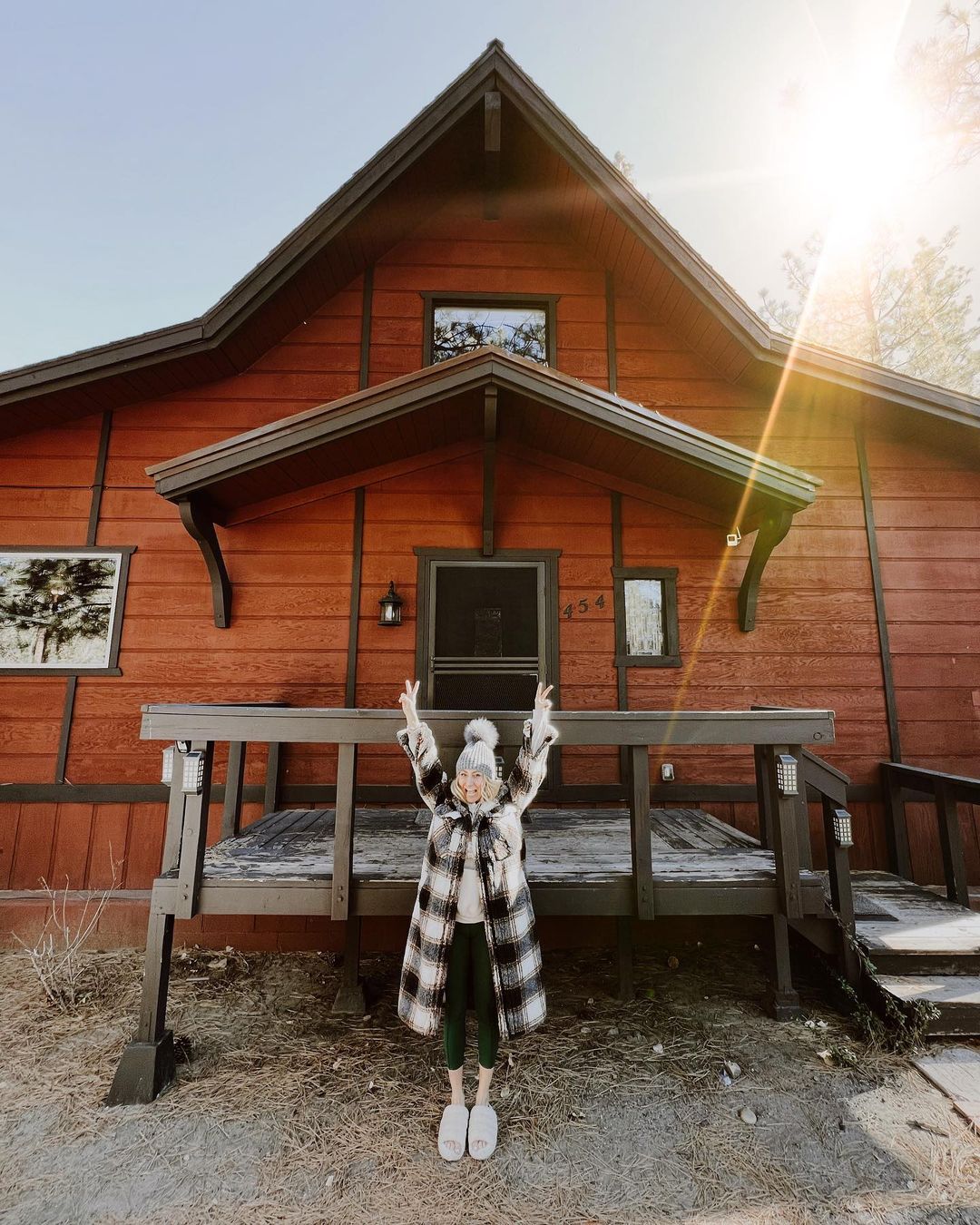 woman in front of house