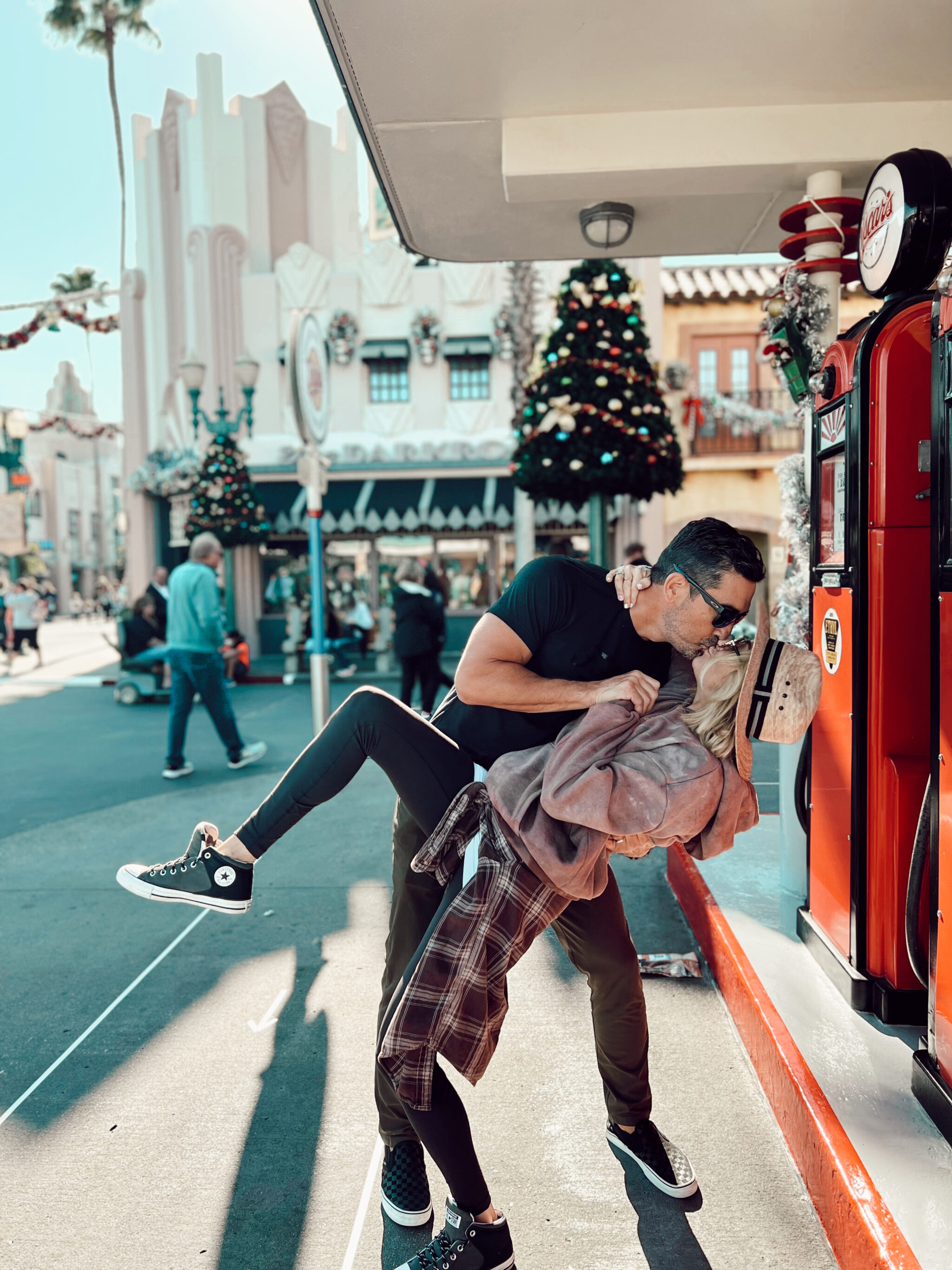 couple kissing at disneyland