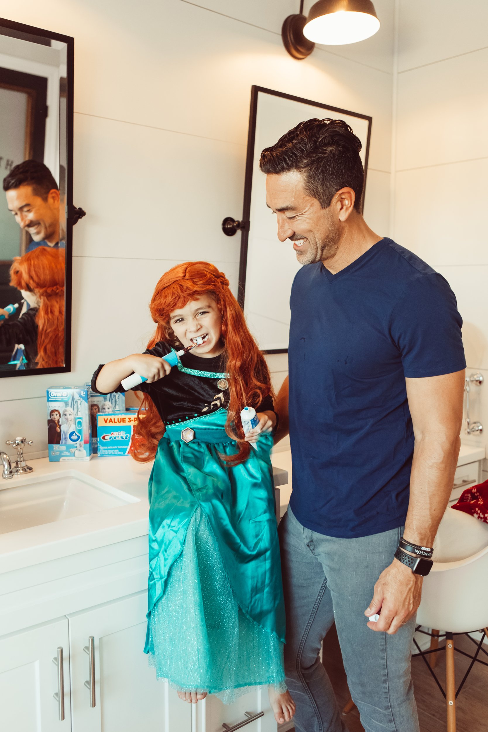 dad with kid brushing teeth