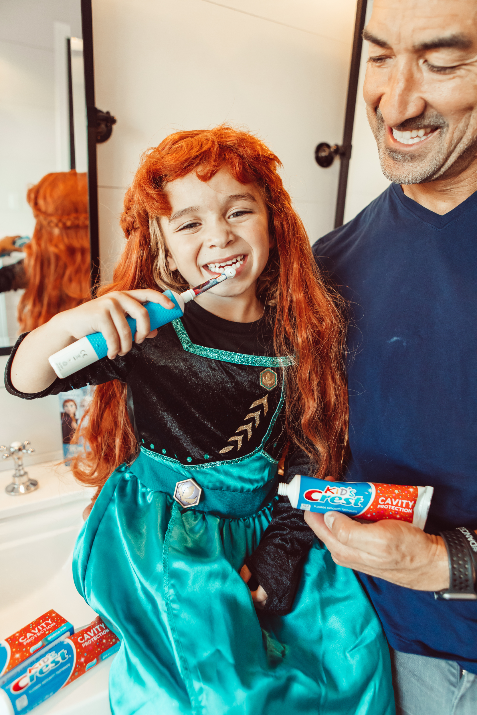 dad and son brushing teeth