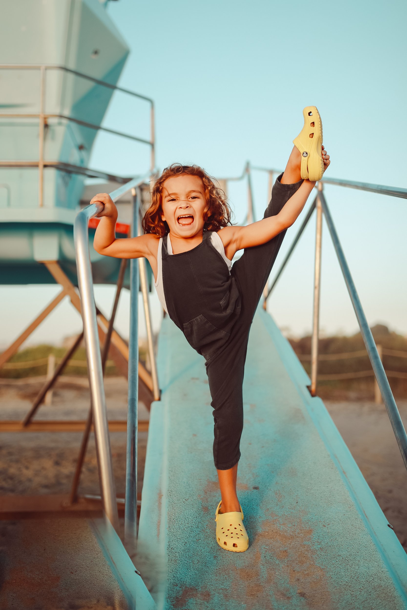 boy dancing on lifeguard station