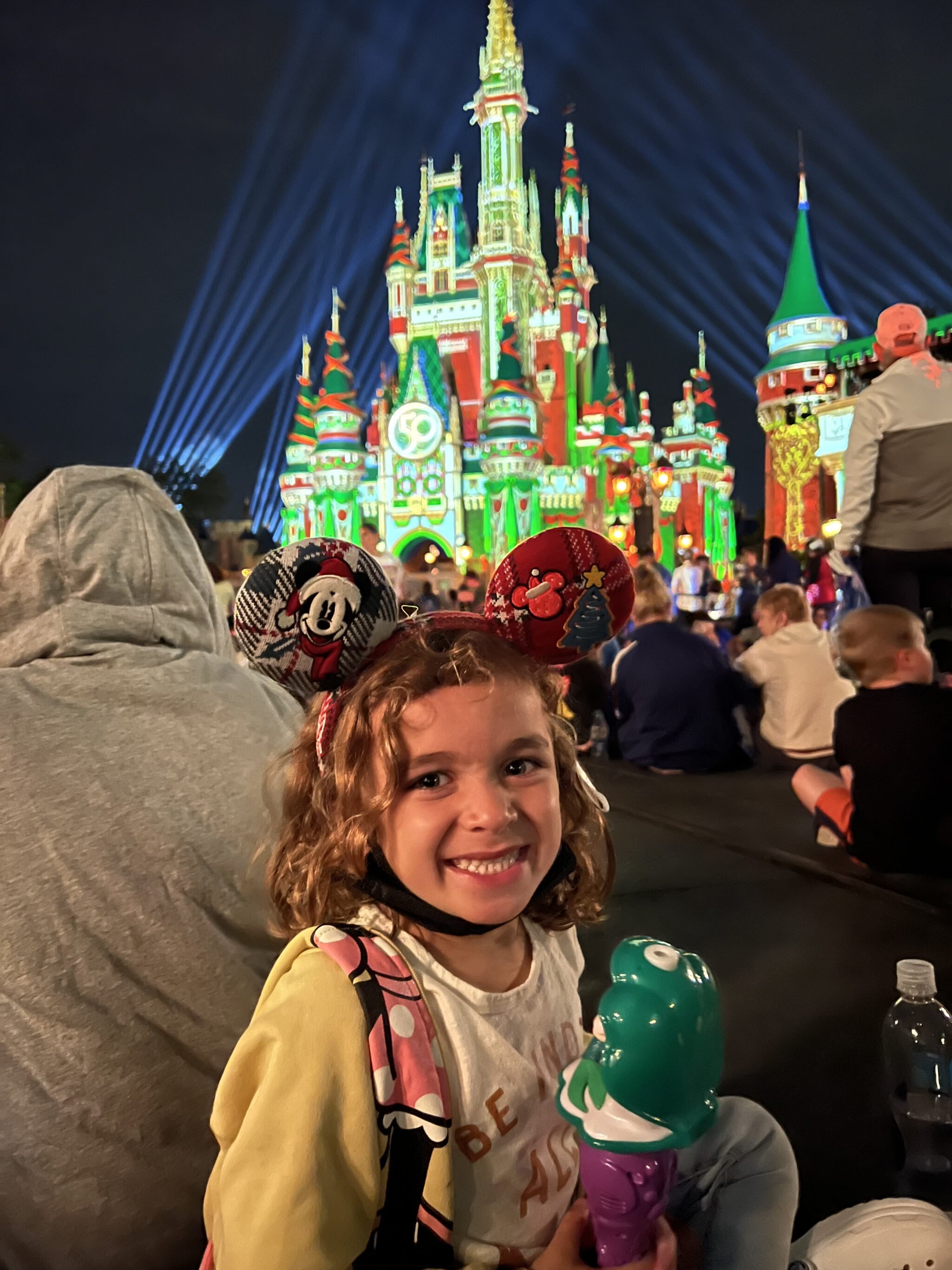 child at christmas at disney world