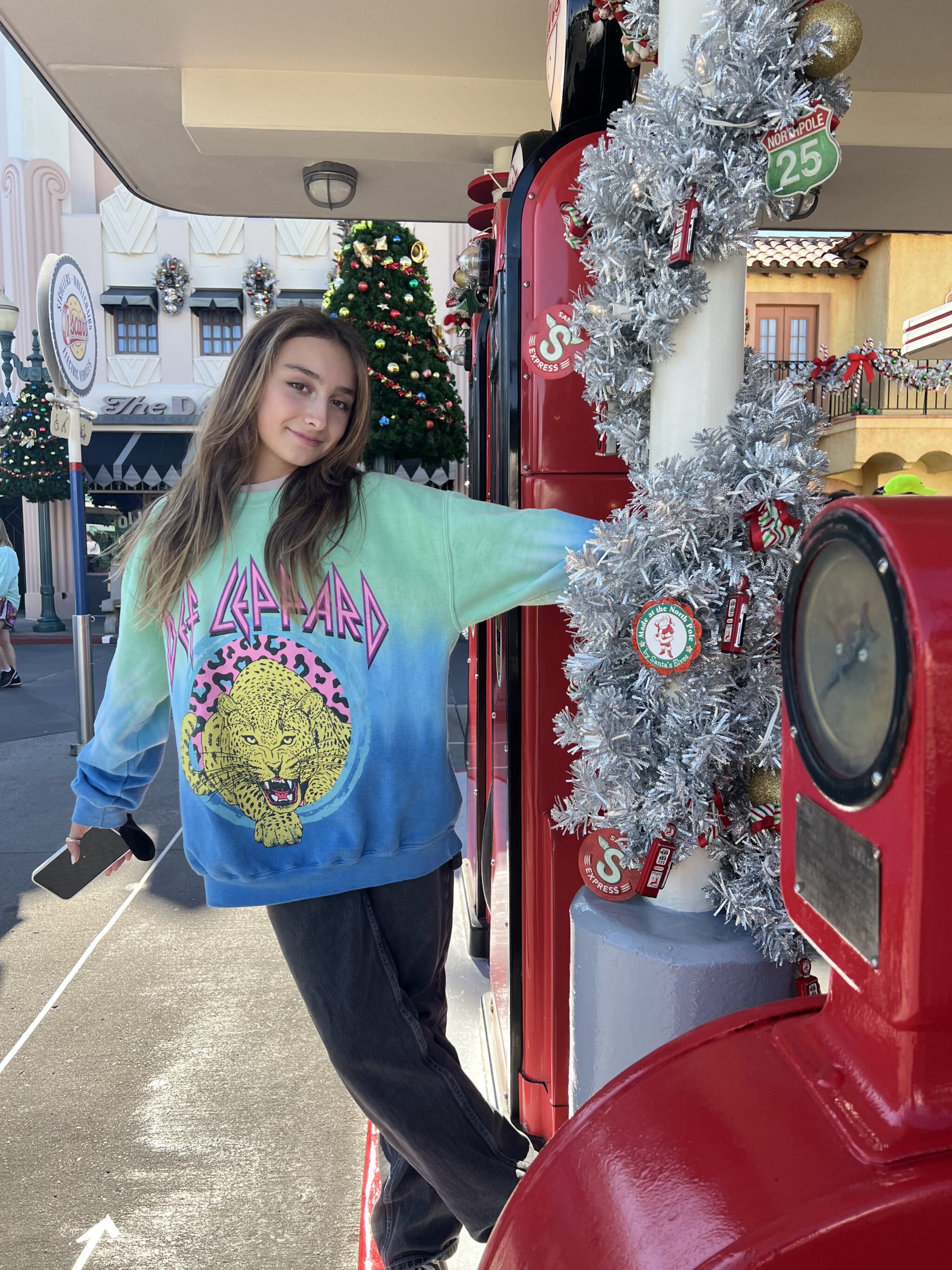 girl posing by christmas decorations