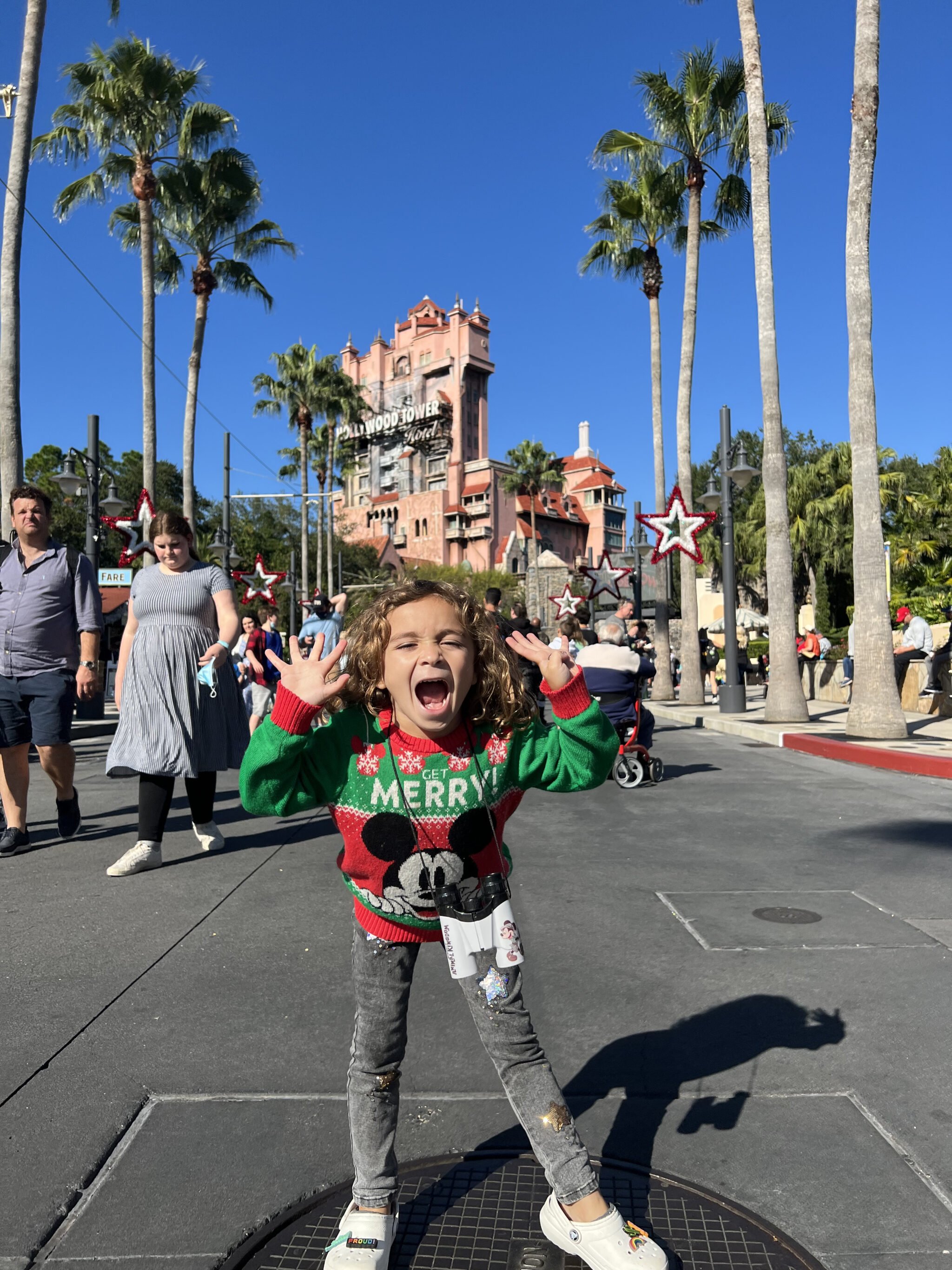 boy standing in front of hollywood tower hotel